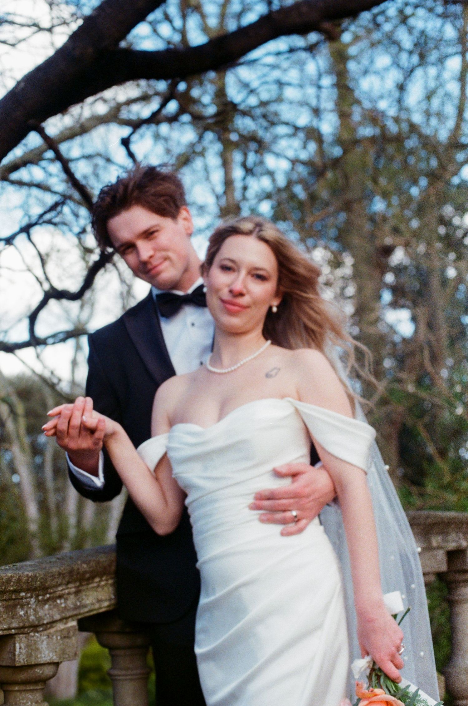 Romantic couple portrait on bridge at York House gardens