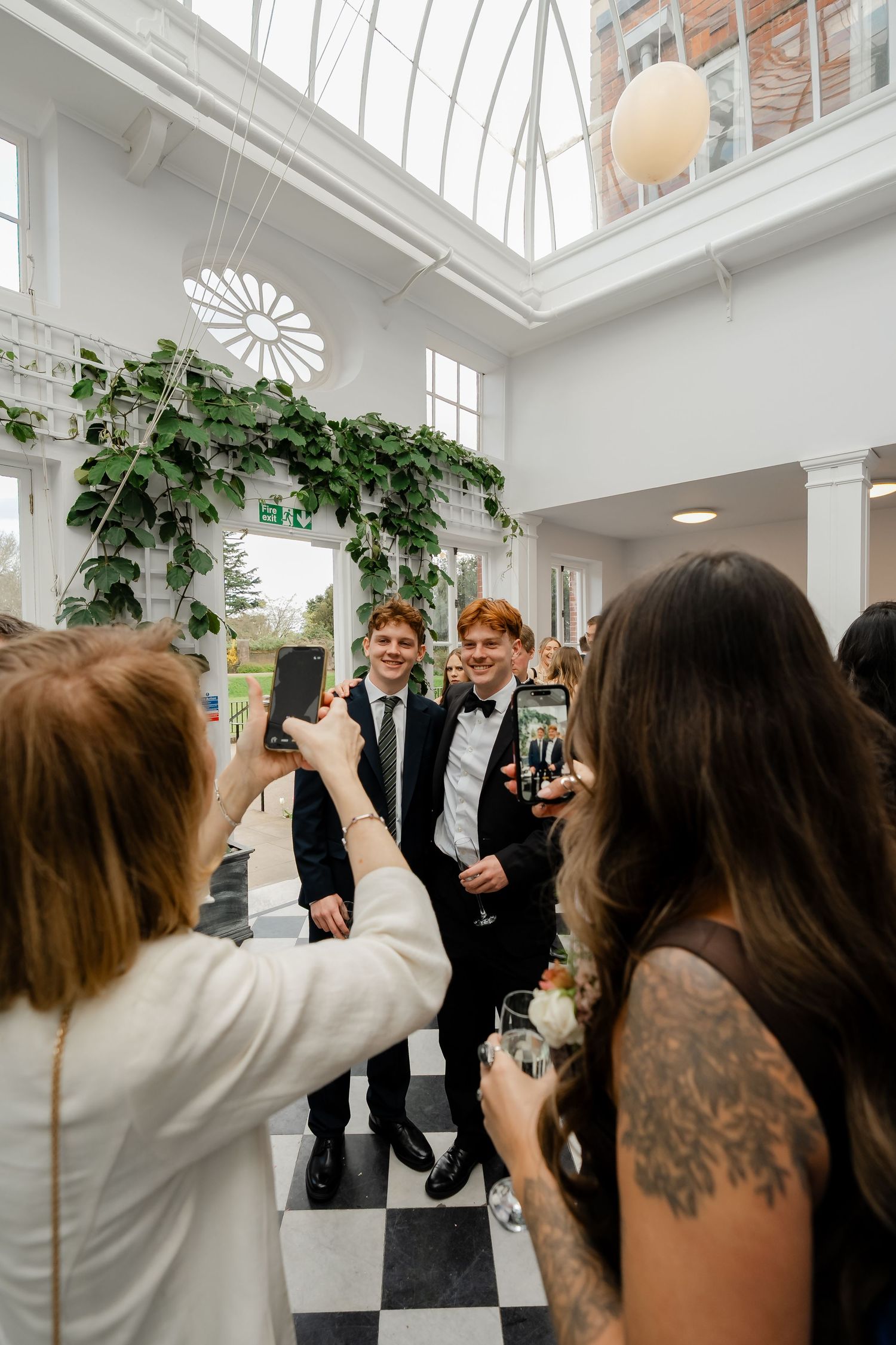 Guests enjoying cocktails in York House conservatory