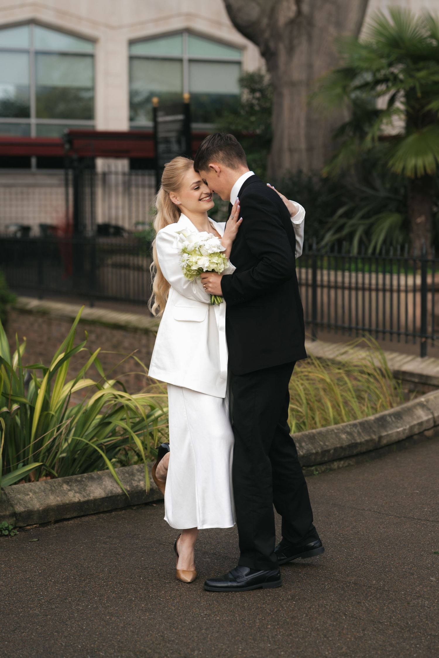 “Couple photographed in Victoria Embankment Gardens during a London city session.”