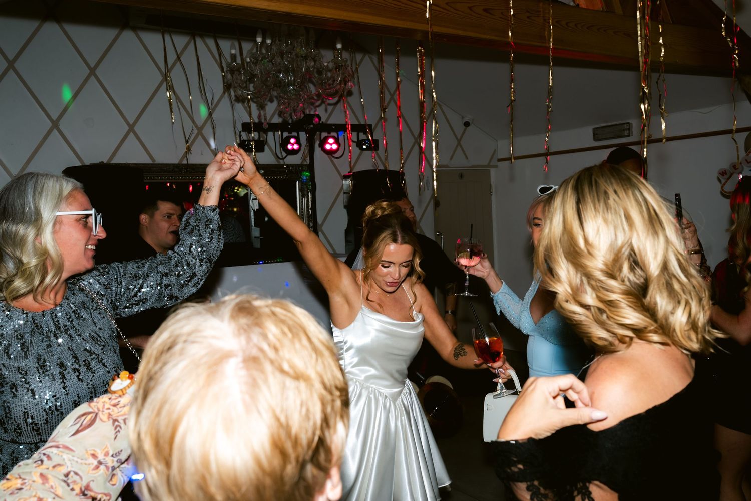Guests celebrating at an elopement party at The Oaks Eltham in London by @lyfphotos