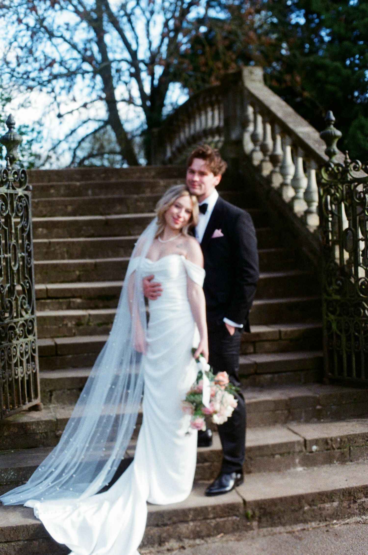 Romantic couple portrait on bridge at York House gardens