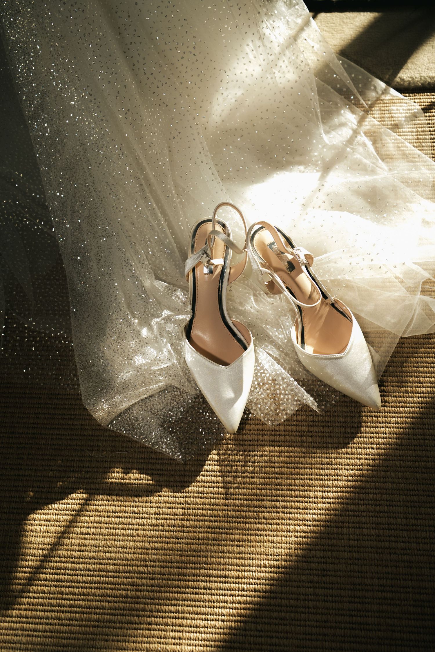 Bridal shoes styled on the wedding dress at South Farm Royston, captured by a UK London wedding photographer. @lyfphotos