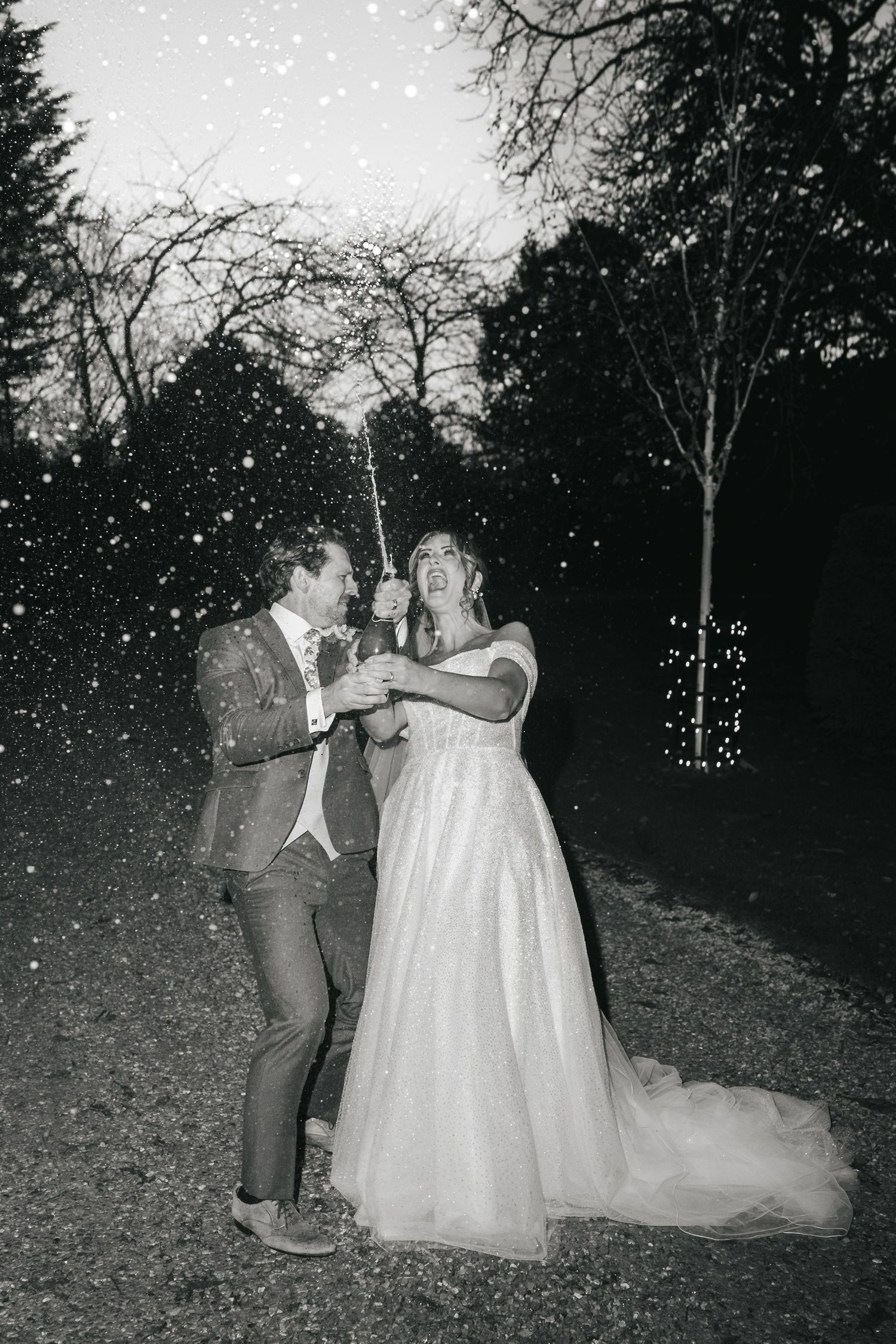 Wedding champagne spray celebration at South Farm editorial shoot captured by @lyfphotos