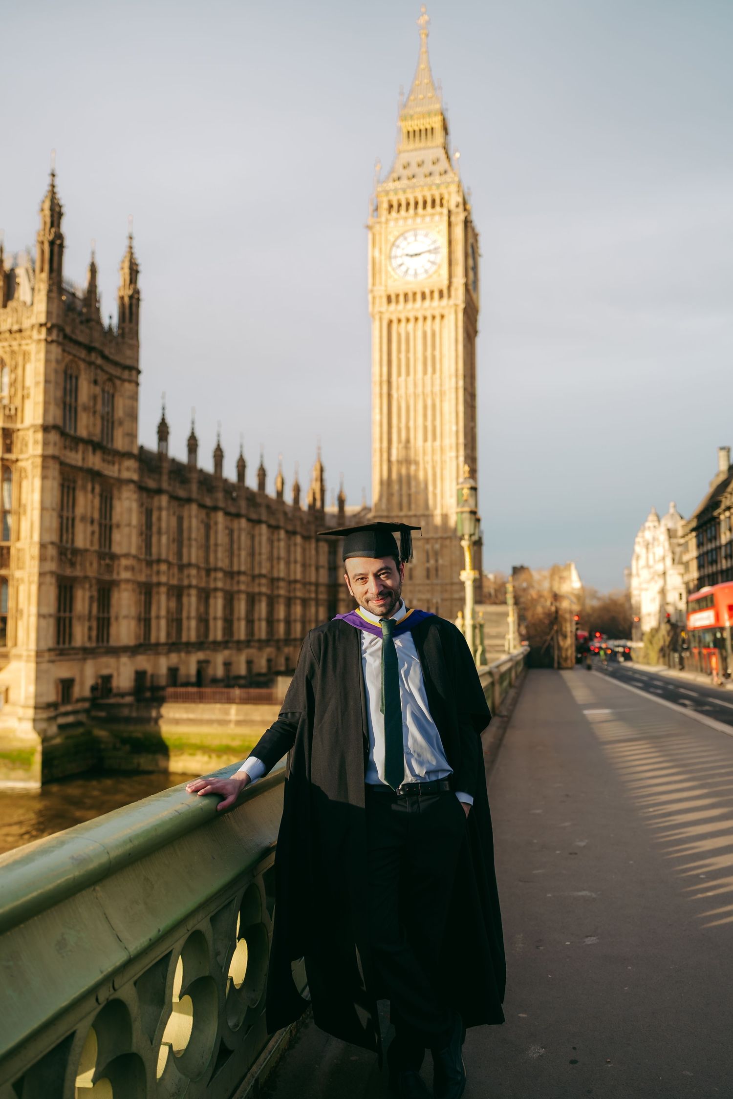 Graduation photos on Westminster Bridge with Big Ben and Houses of Parliament, captured by London photographer @lyfphotos during a London la