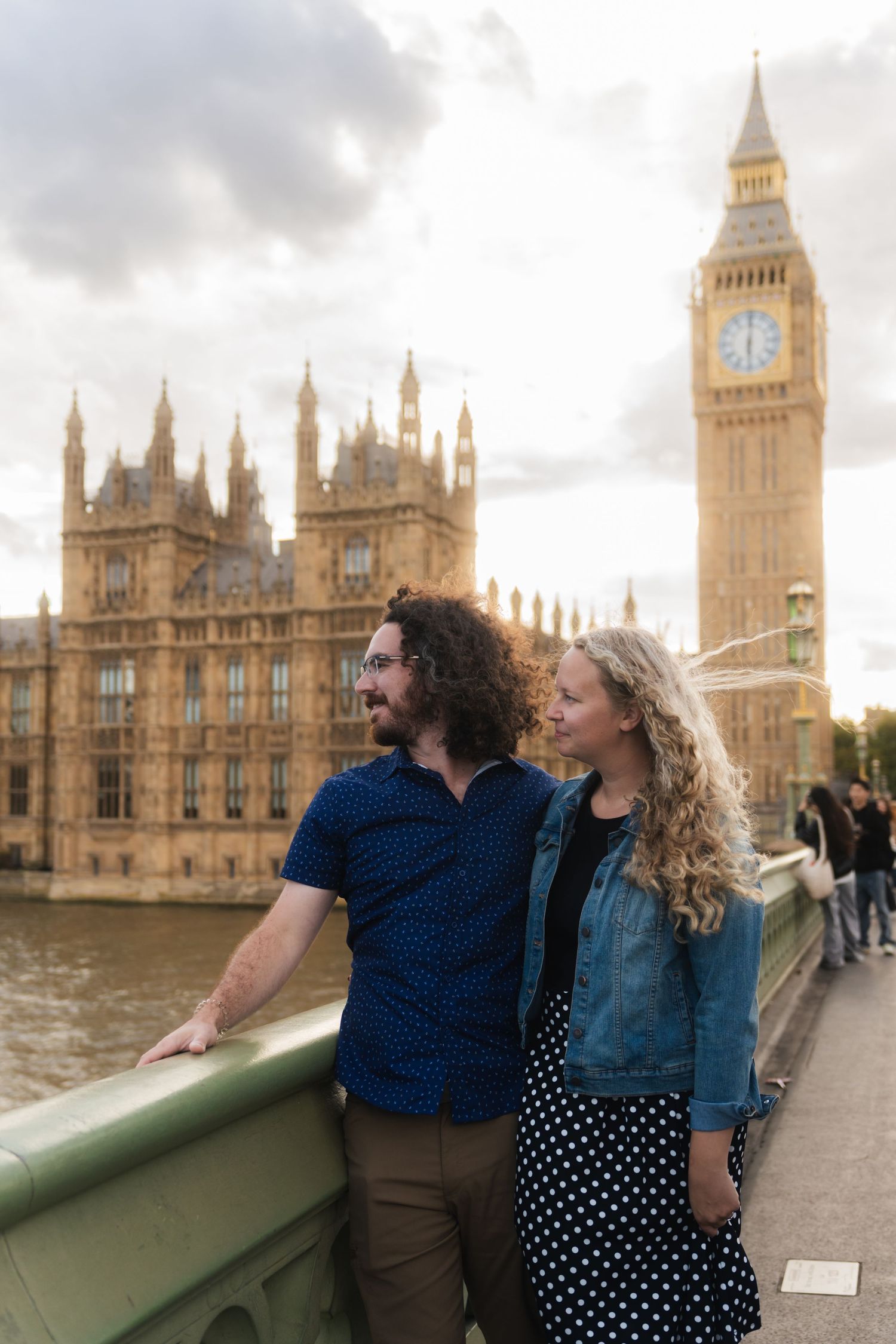 Couple on Westminster Bridge at sunset with Big Ben behind them captured by UK Photographer @lyfphotos