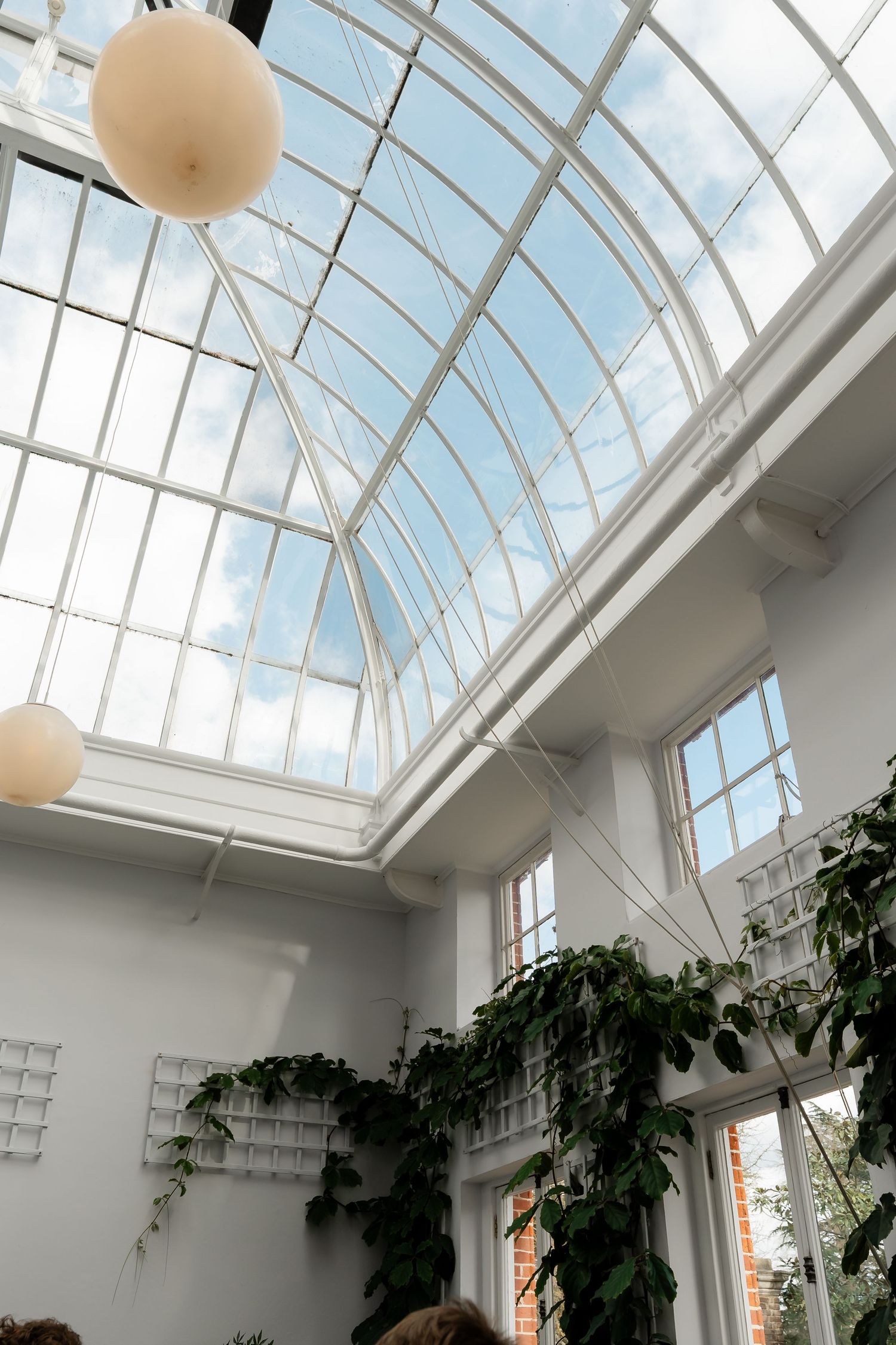 Guests enjoying cocktails in York House conservatory