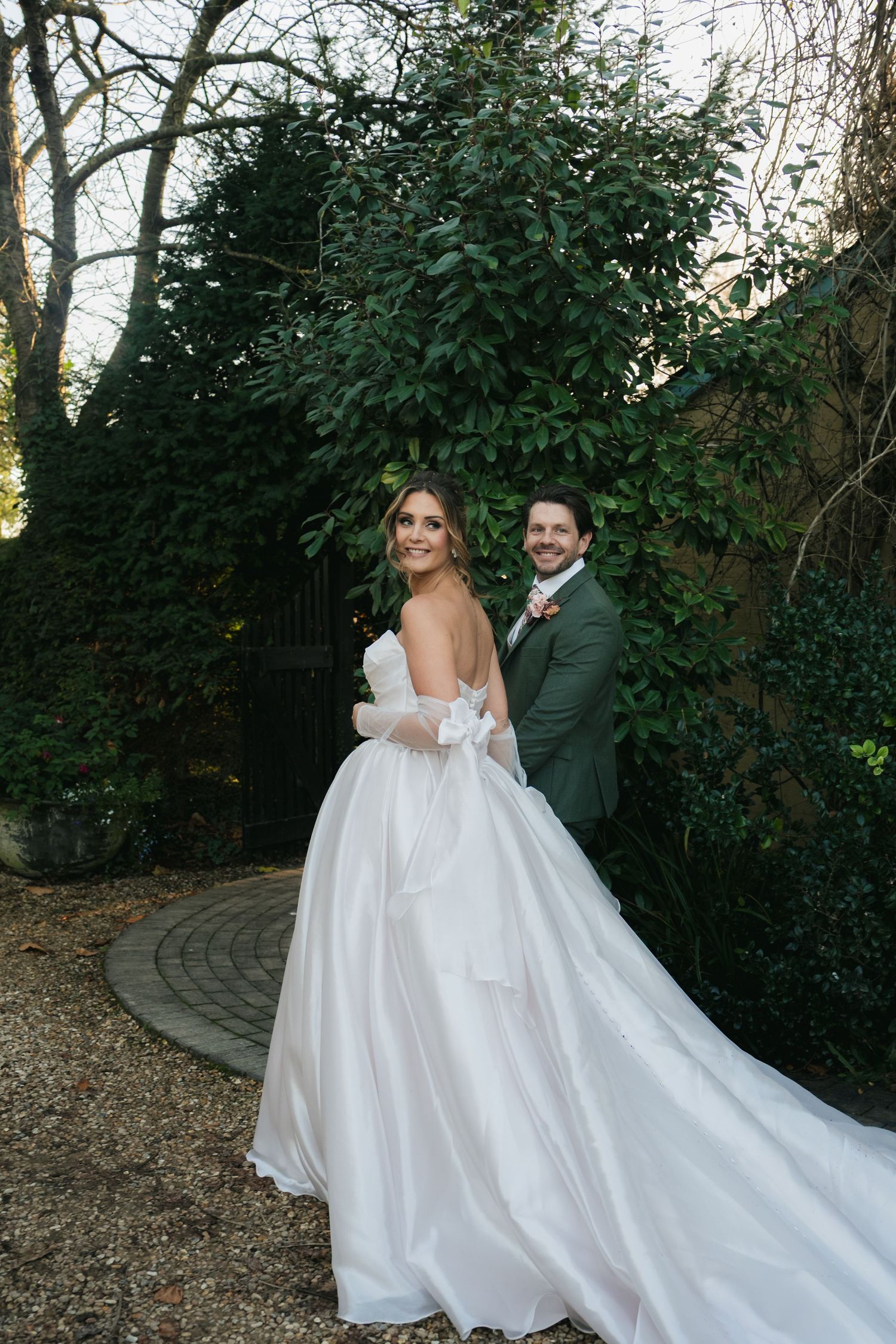 “Bride in a long gown posing for a classic outdoor portrait at South Farm Royston, captured by a UK London wedding photographer.”
