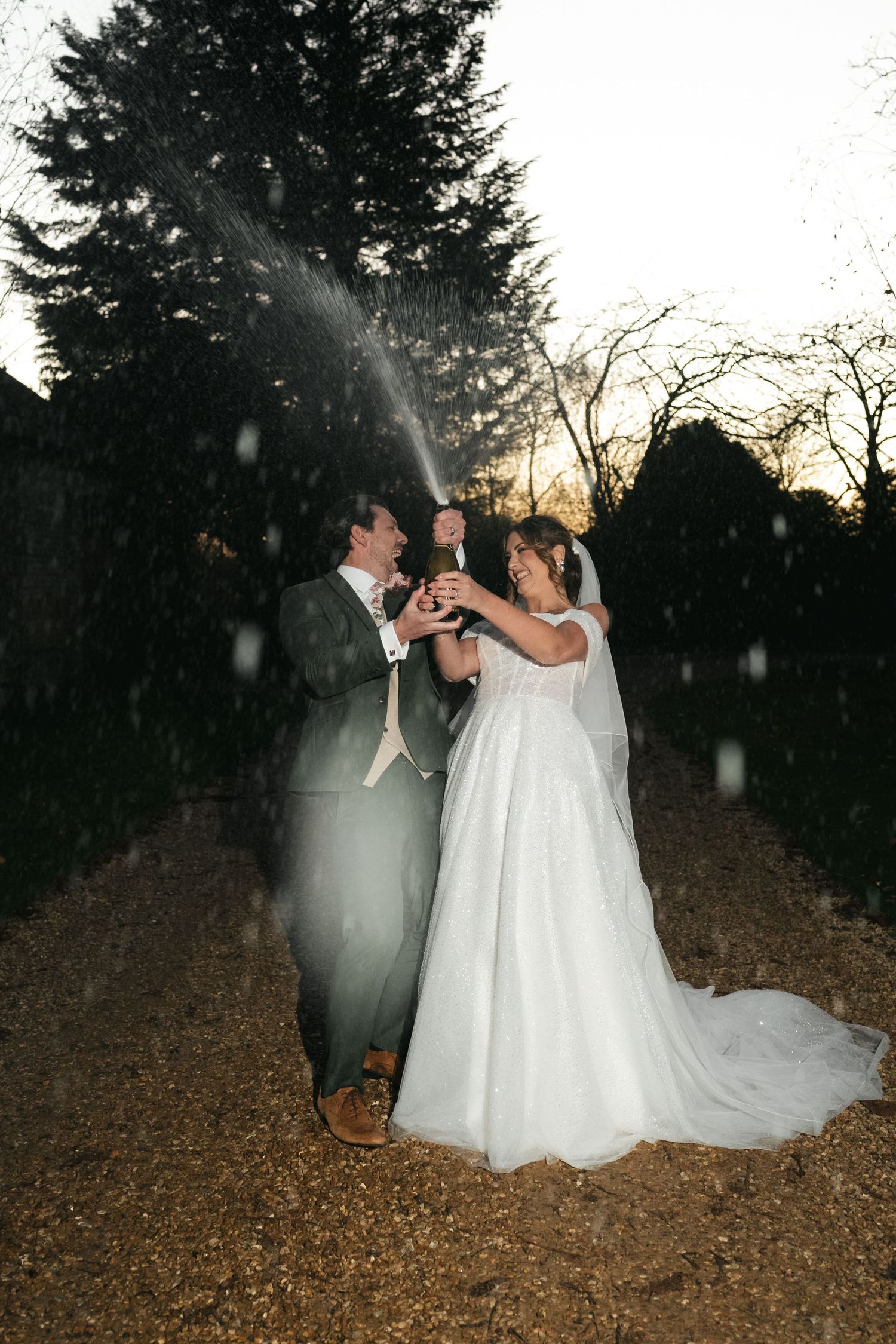 Wedding champagne spray celebration at South Farm editorial shoot captured by @lyfphotos