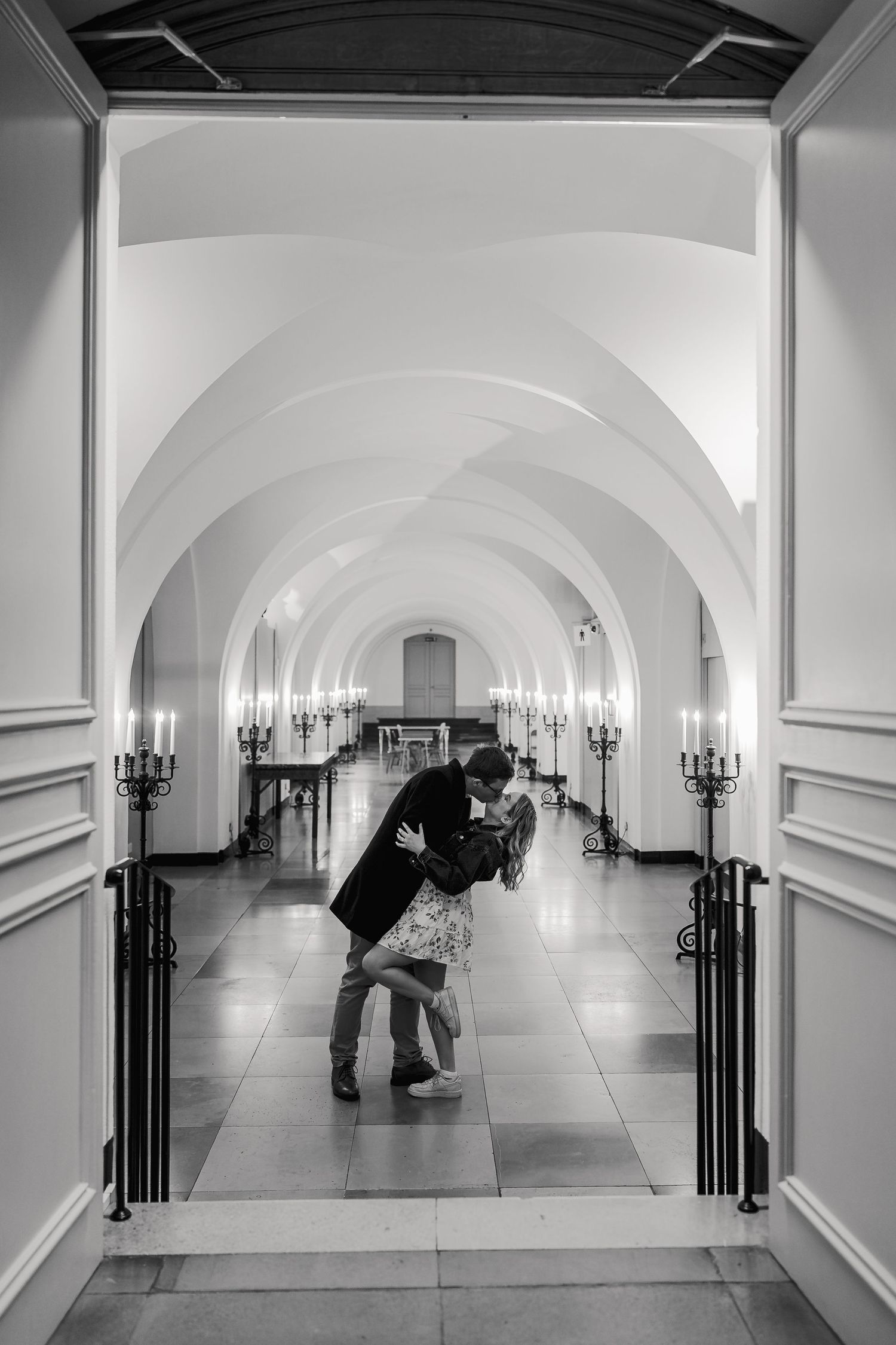 Black and white engagement portrait inside Banqueting House London with grand ceiling