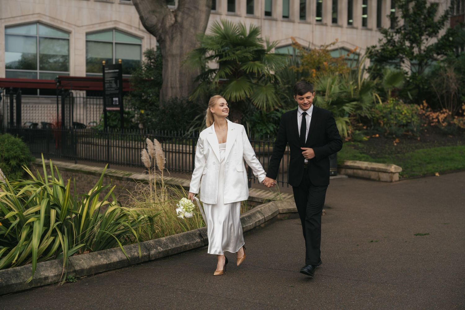 “Couple photographed in Victoria Embankment Gardens during a London city session.”
