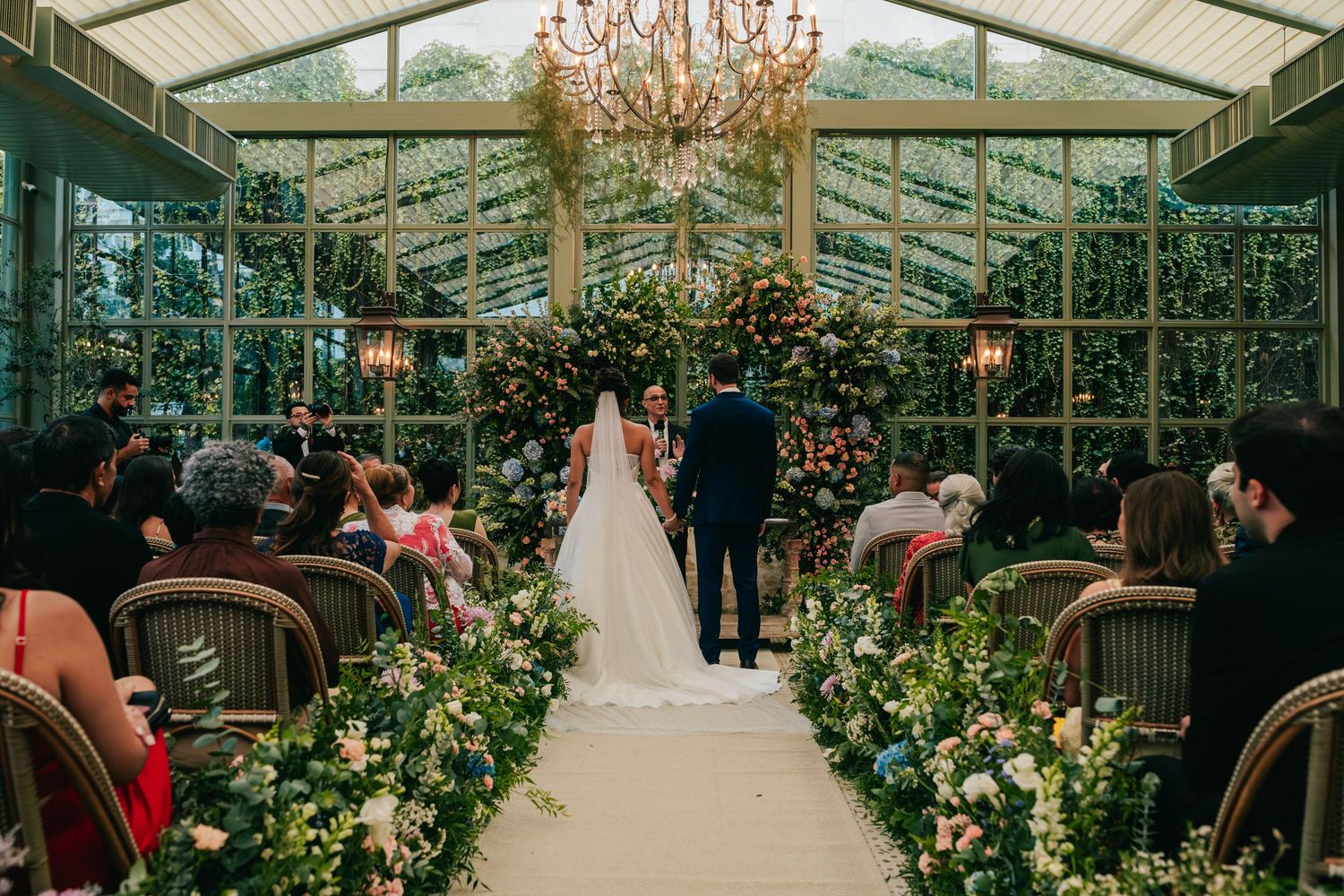 Emotional greenhouse wedding ceremony at Botânico Quintal in São Paulo, Brazil.