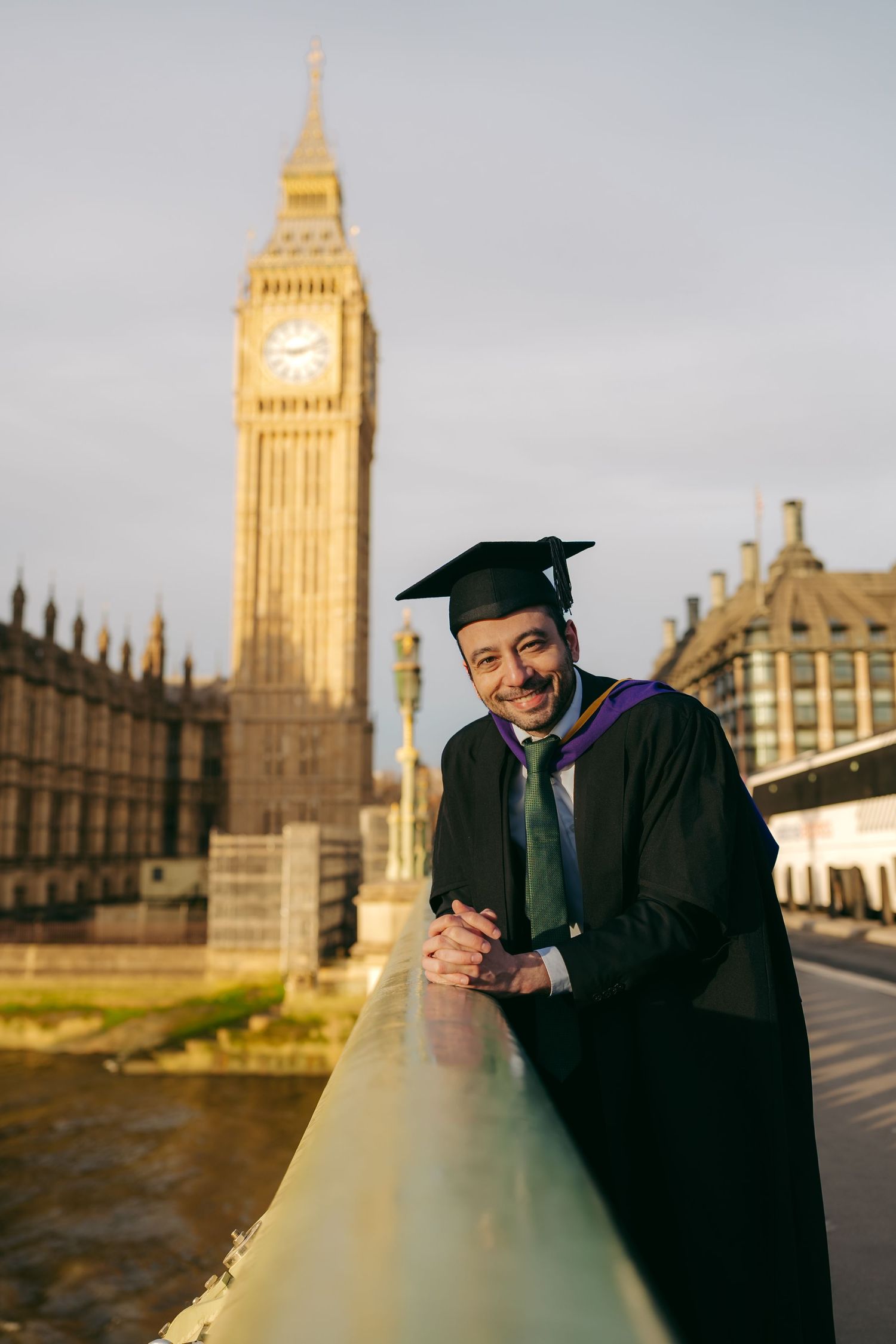 Graduation photos on Westminster Bridge with Big Ben and Houses of Parliament, captured by London photographer @lyfphotos during a London la