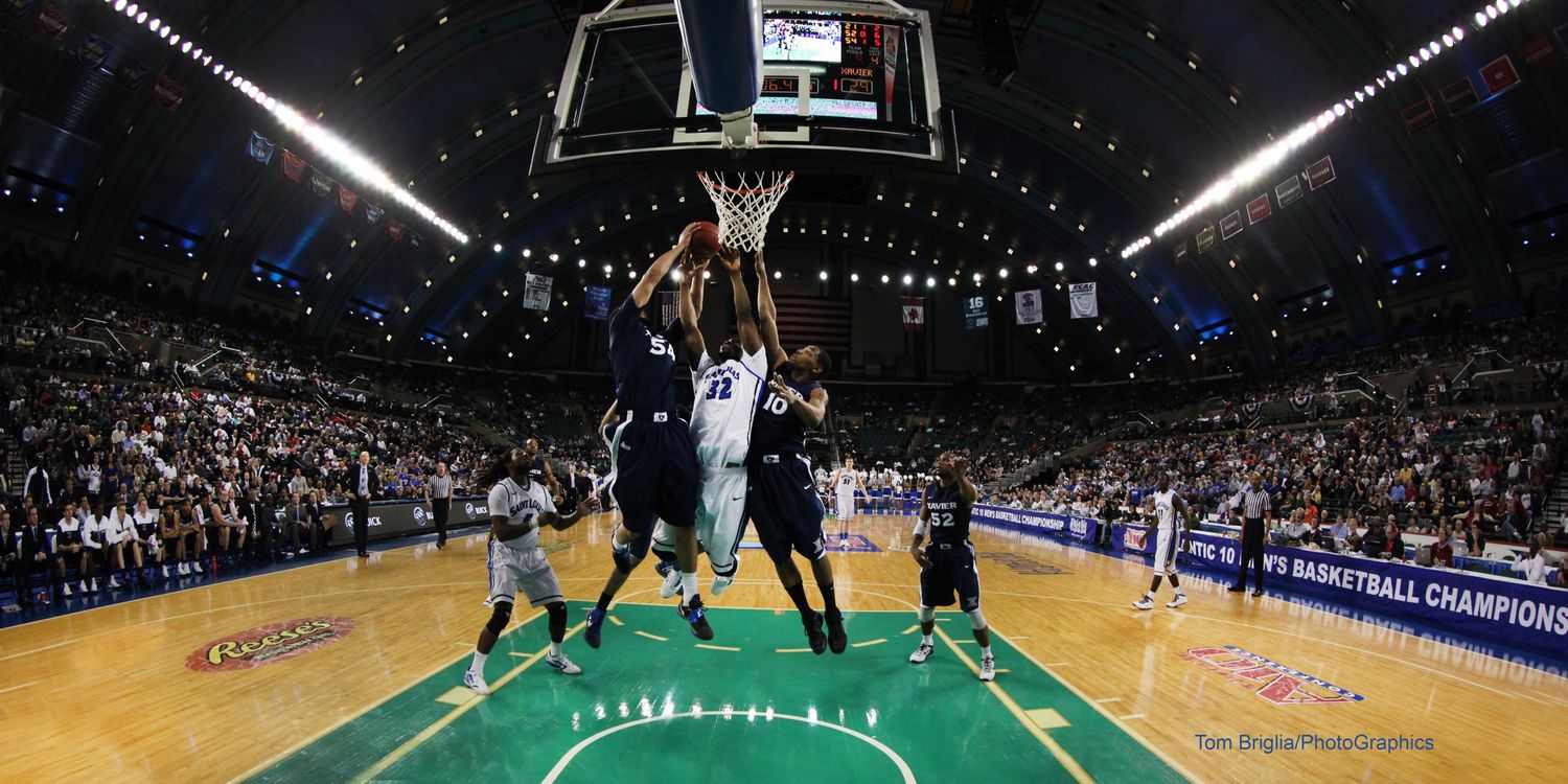 Wide angle view of a professional basketball arena during a game.