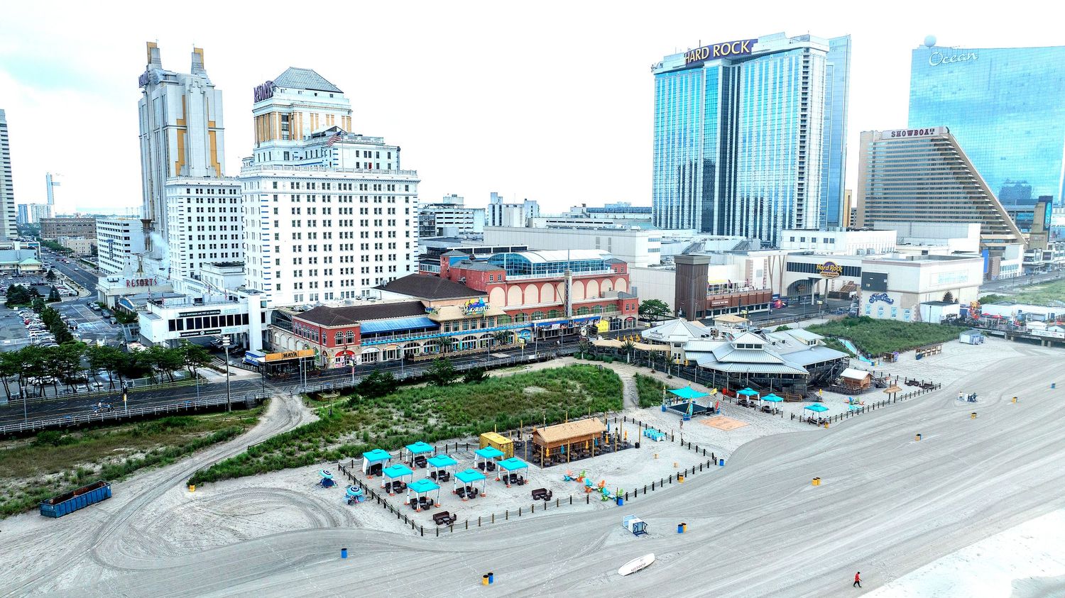 Panoramic aerial view of Atlantic City boardwalk and beachfront properties.