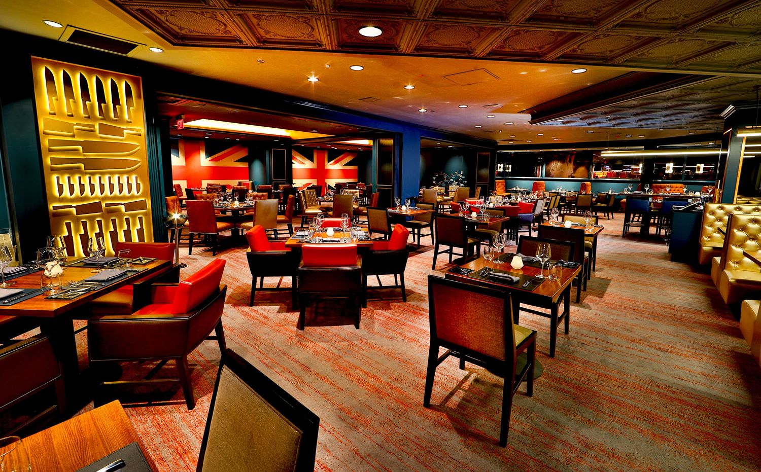 Panoramic view of an upscale bowling alley interior with polished wood lanes and modern decor.