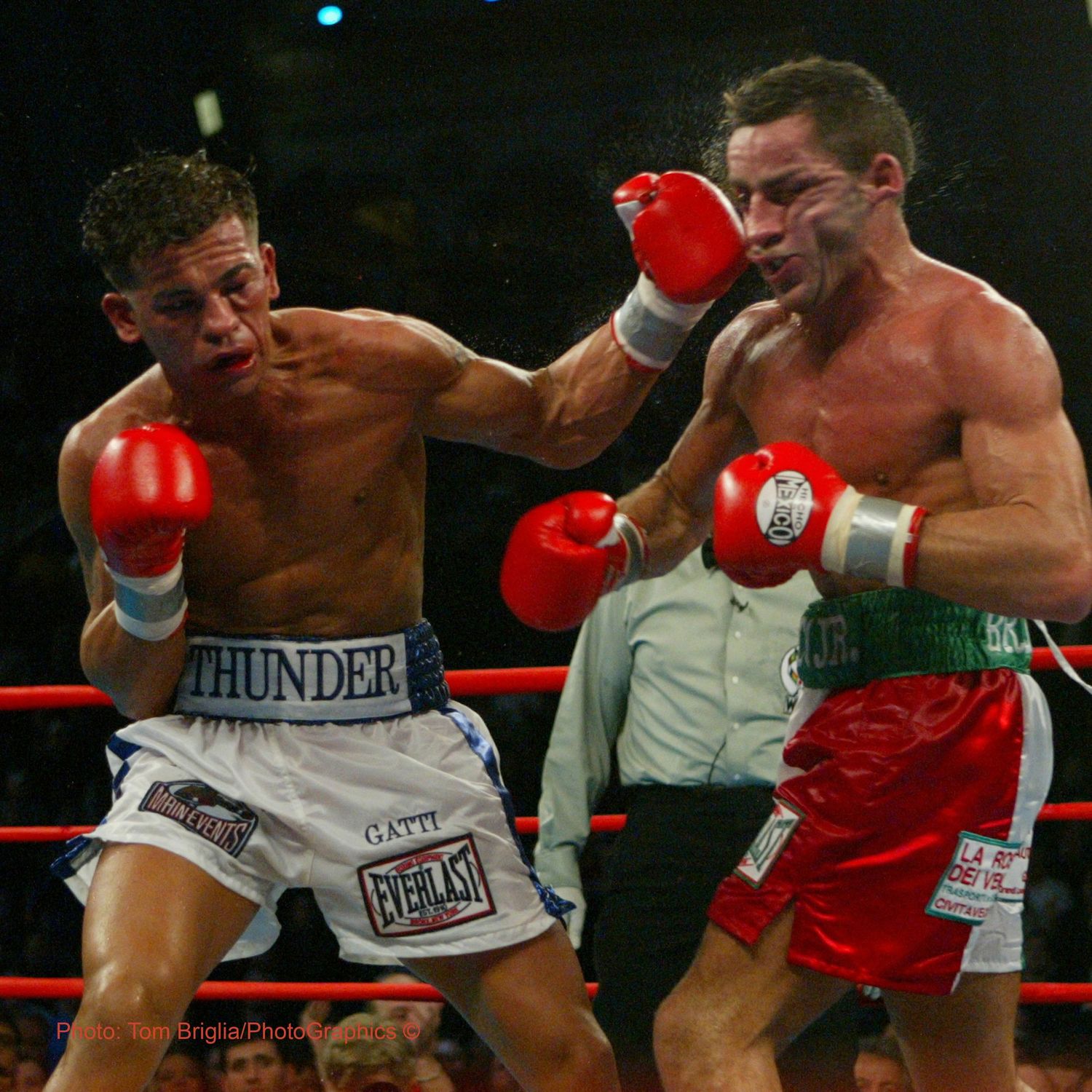 Intense boxing match sequence showing fighters trading blows in the ring.