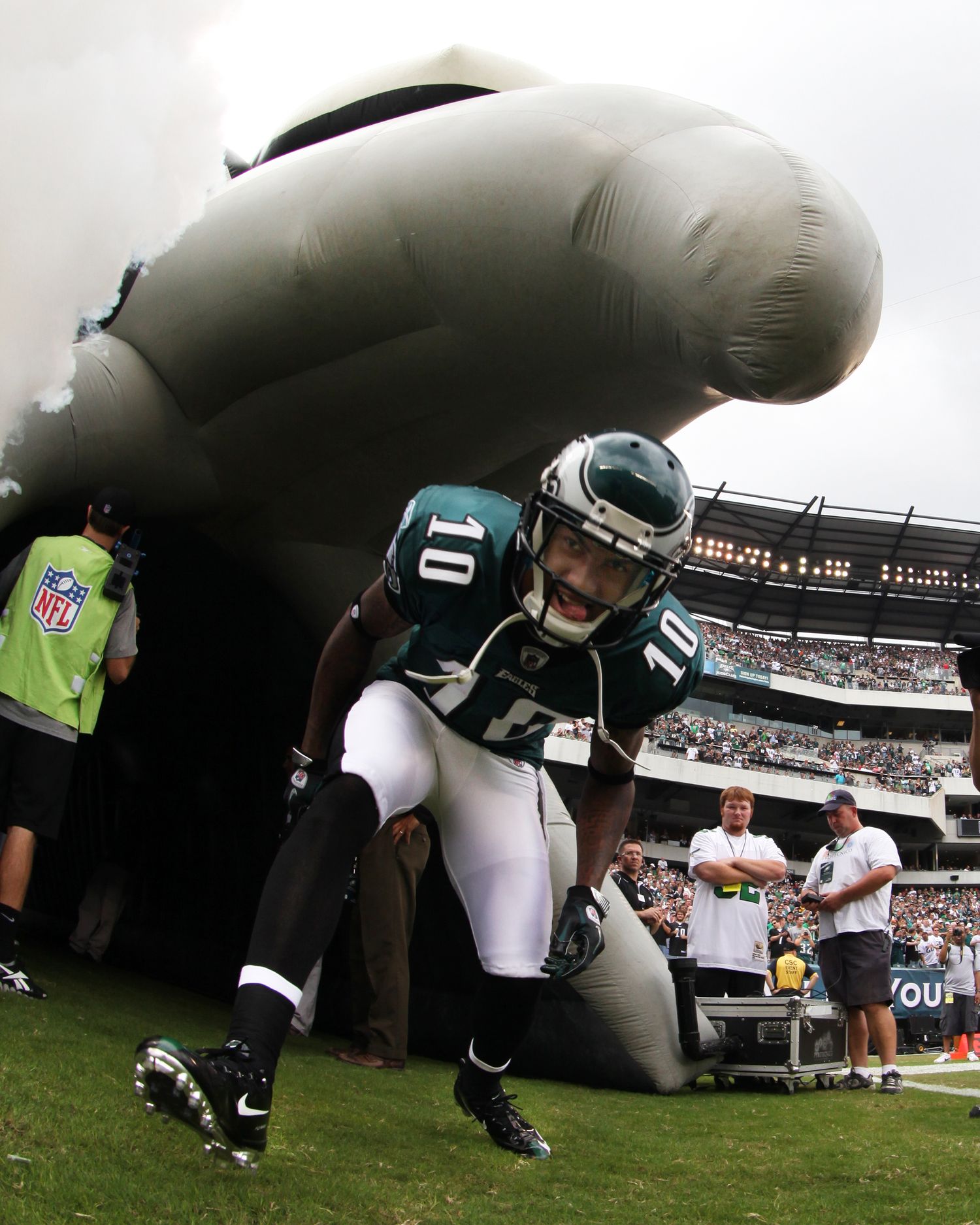 Large inflatable NFL mascot tunnel collapsing on the field before a Philadelphia Eagles game.