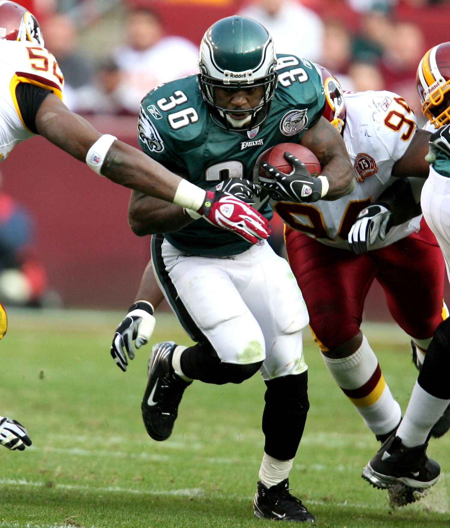 Philadelphia Eagles running back breaks through tackles during NFL game against Washington Redskins.