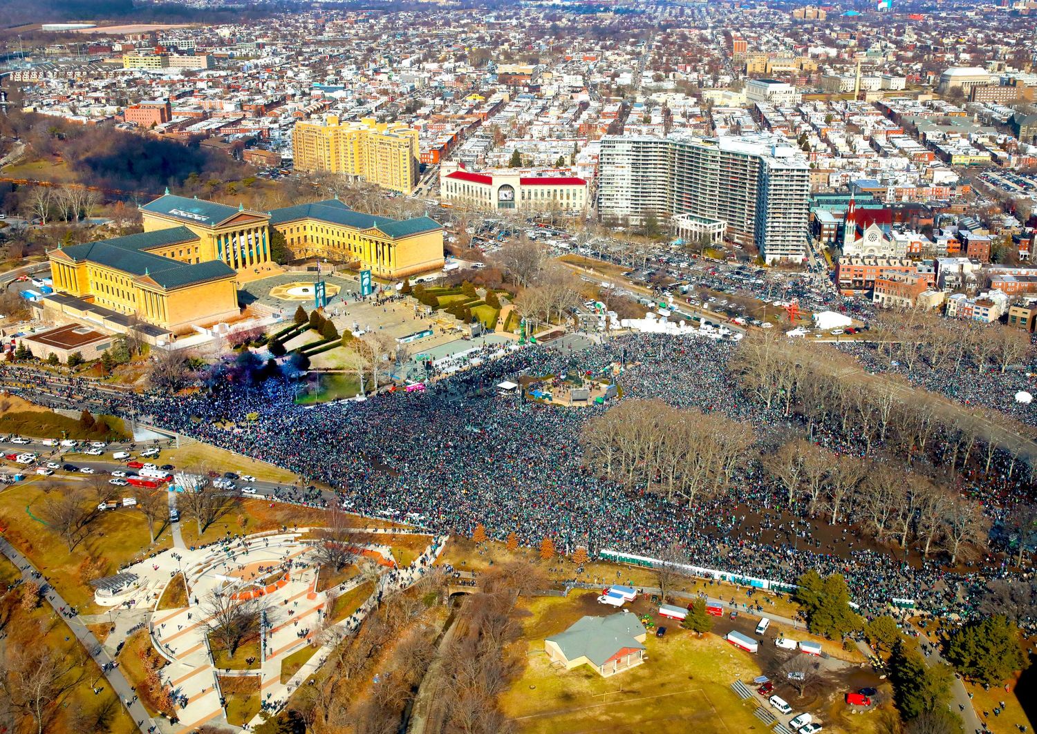 Aerial winter view of Philadelphia's Art Museum area with large crowds gathered for an event.