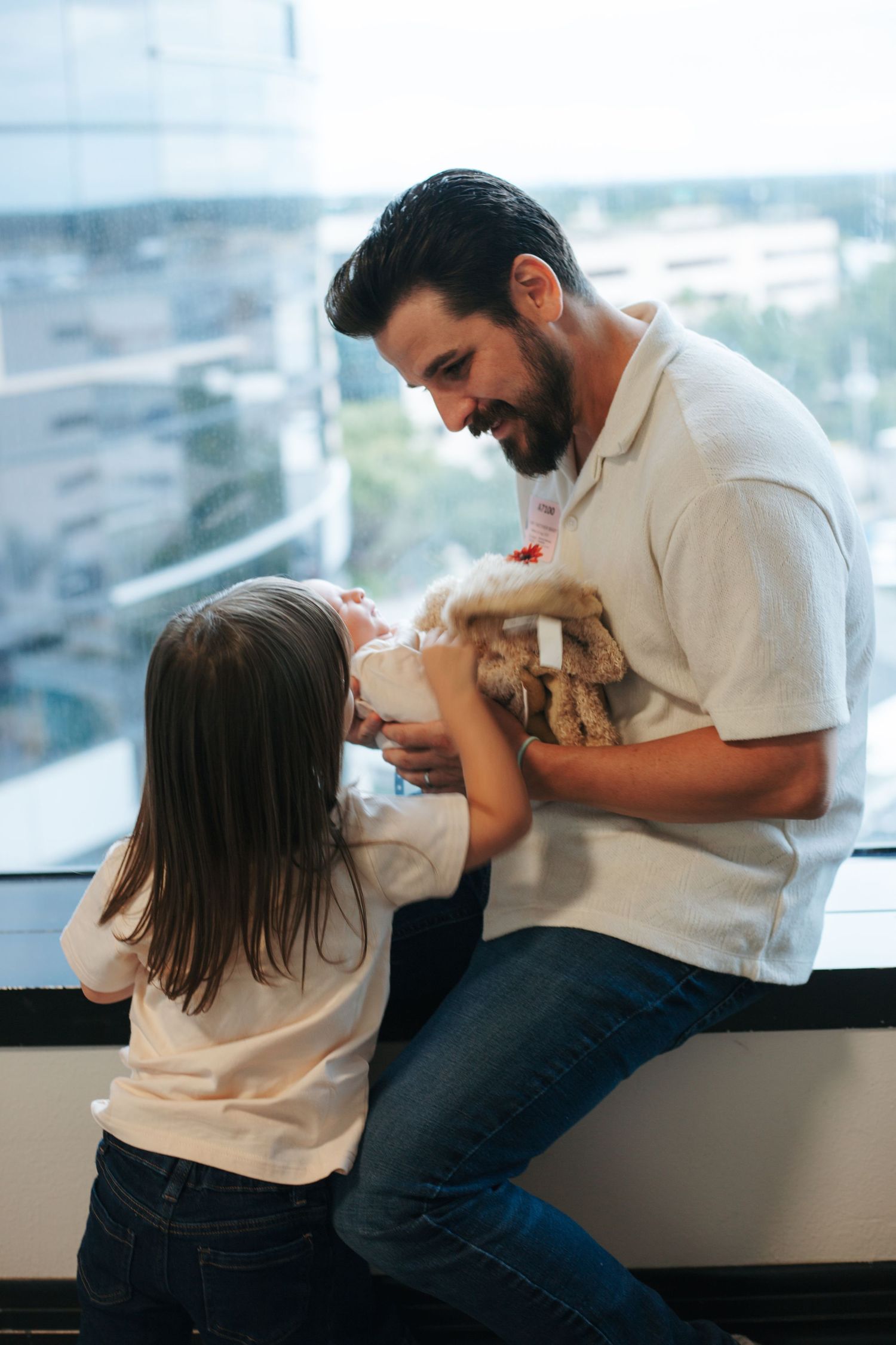 A touching series of candid moments between a parent and child playing together by a window.