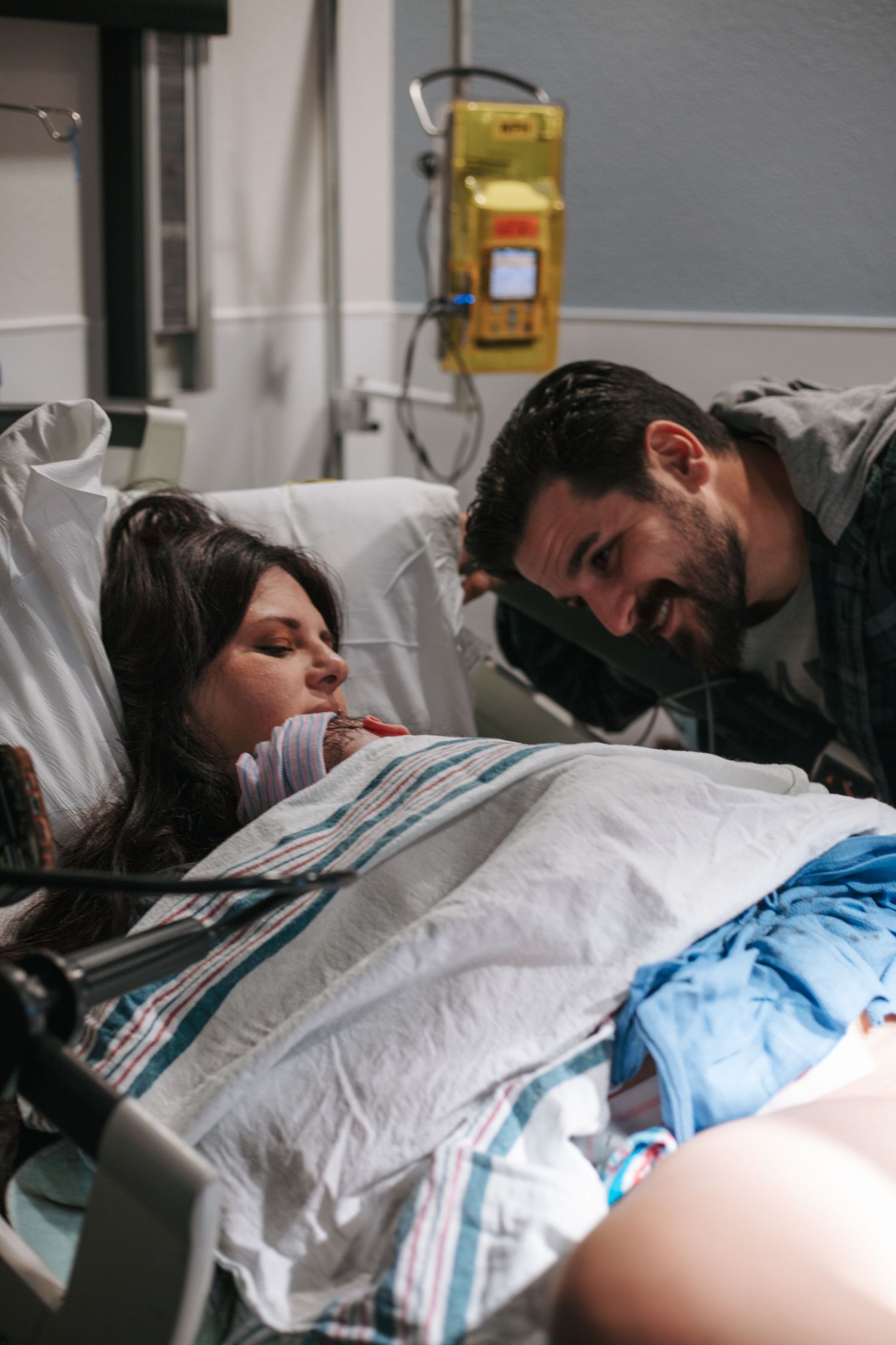 A tender moment captured in a hospital delivery room.