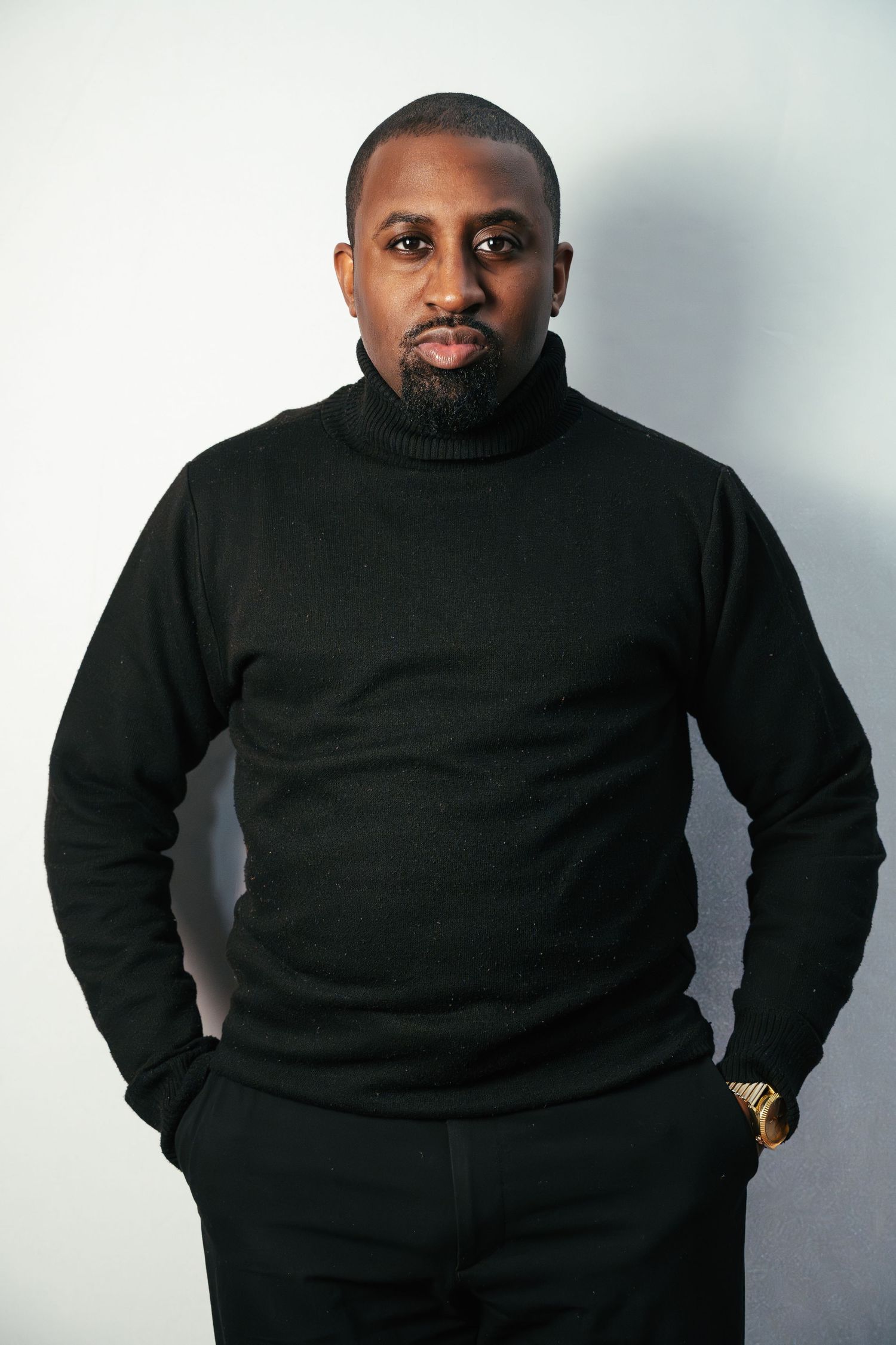 A person wearing a black turtleneck sweater poses against a light gray background in a four-panel collage.