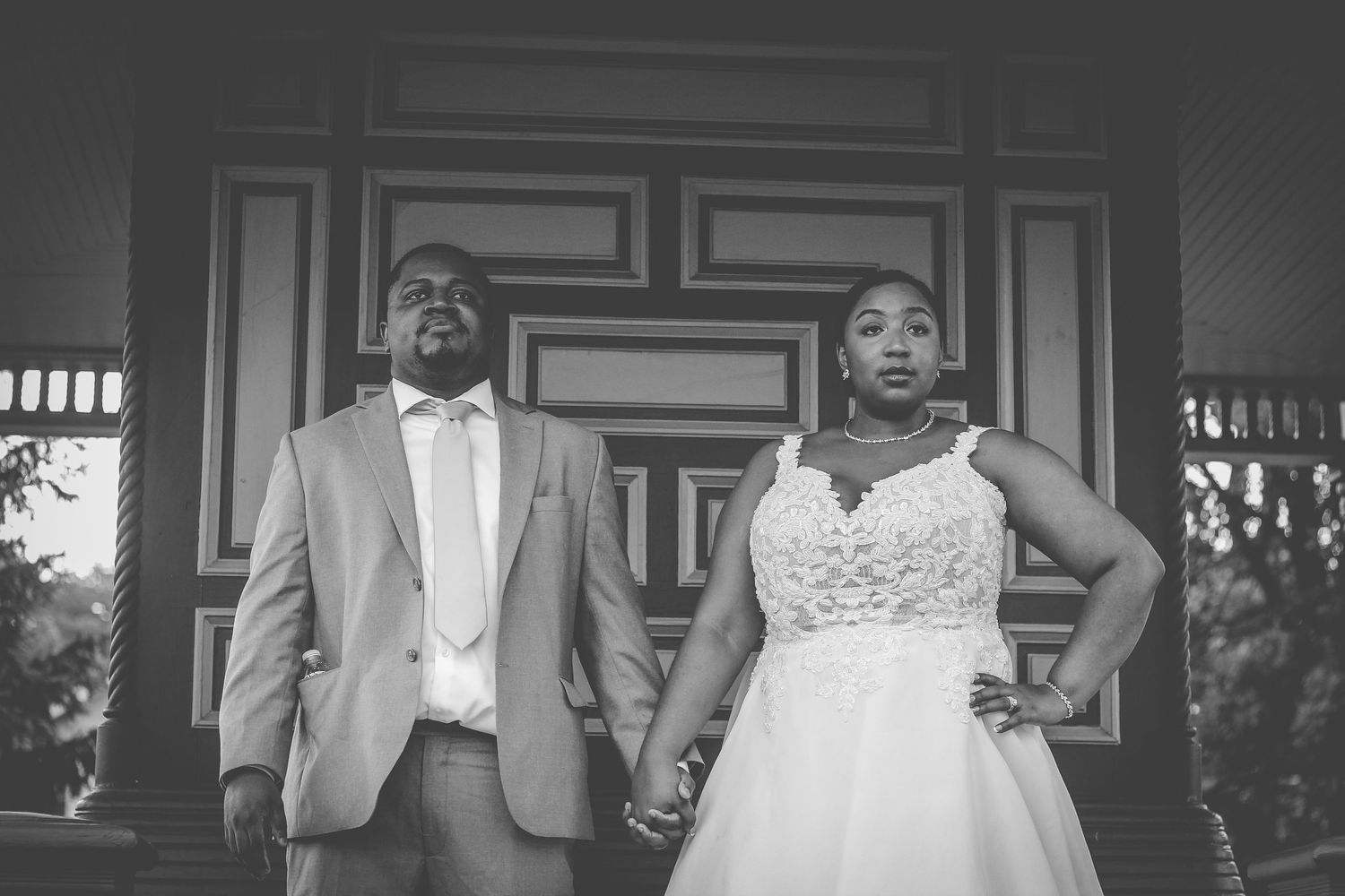 Black and white wedding photos showing joyful moments and candid reactions during a celebration.