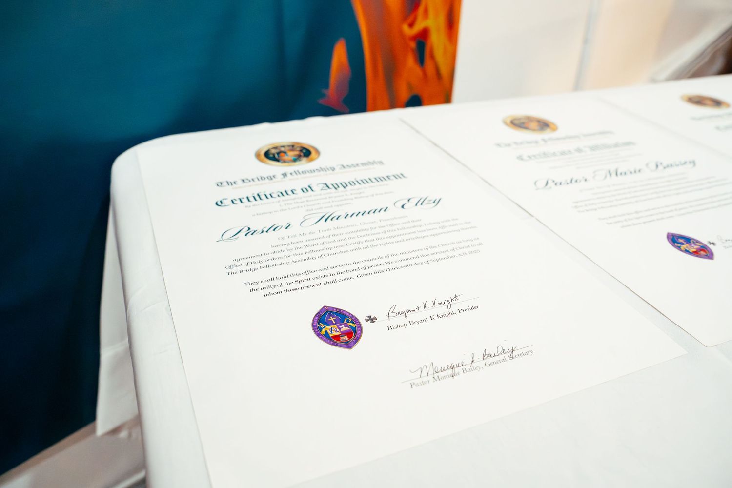 A series of official NASA documents and certificates laid out on a white surface with logos visible.