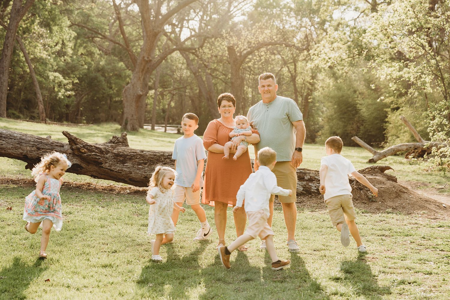 Family running playing outdoor lifestyle session Central Texas Sudden Joy Visuals