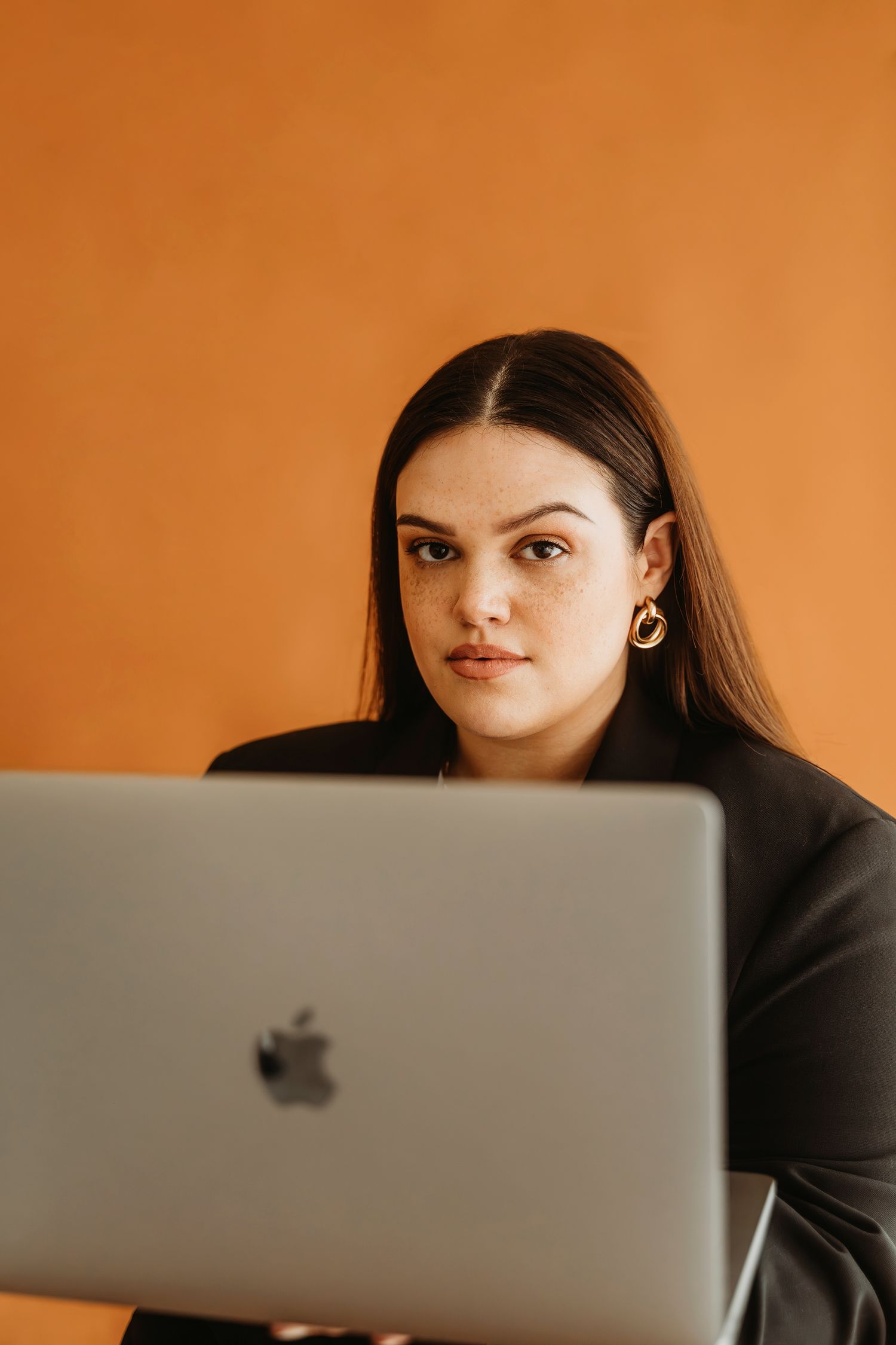 Female entrepreneur personal branding session studio laptop terracotta Waco TX Sudden Joy Visuals