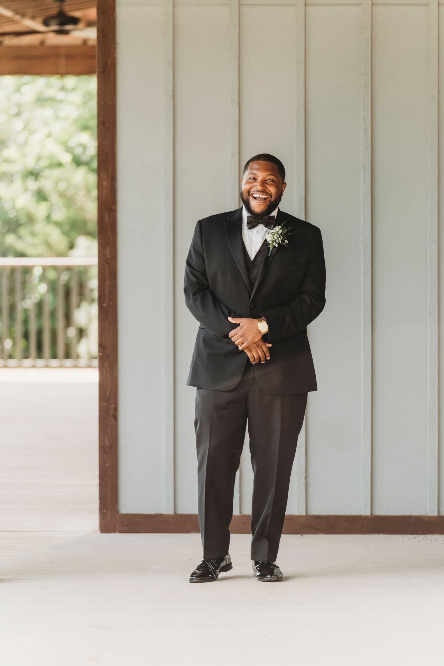 Groom standing in tuxedo wedding day portrait Waco TX Sudden Joy Visuals