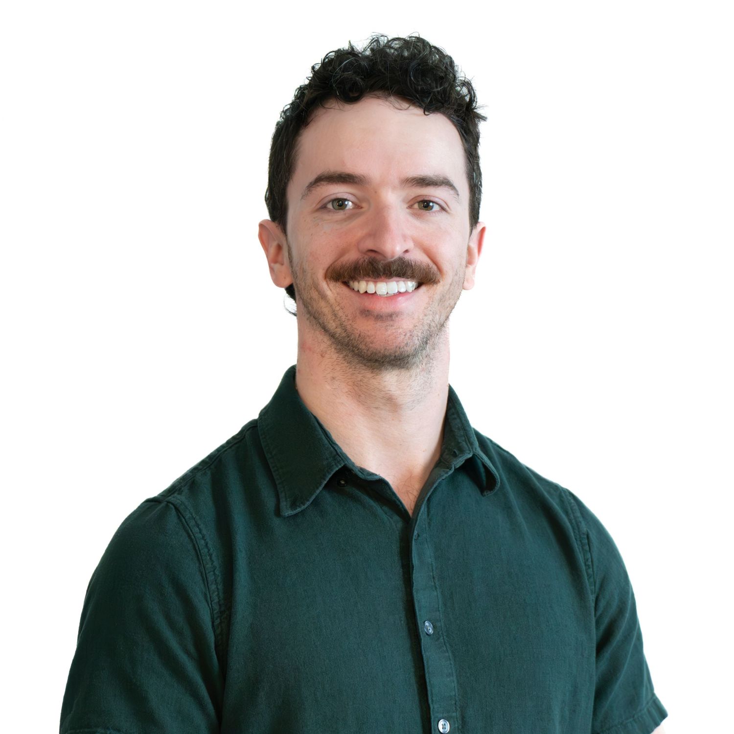 Professional headshot of person in dark green button-down shirt against white background.