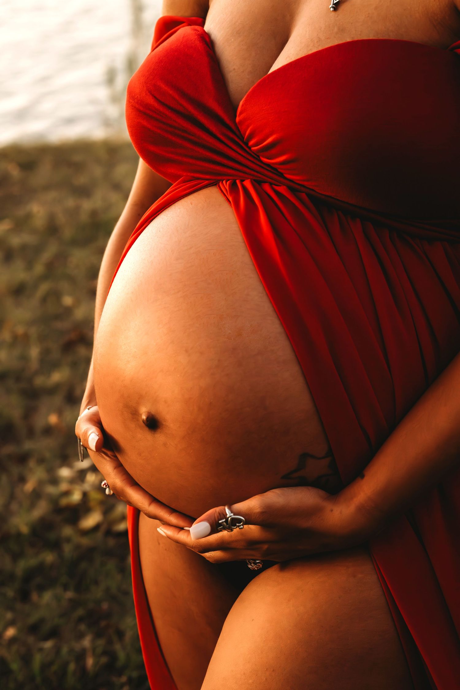Maternity bump closeup detail red dress Waco TX Sudden Joy Visuals