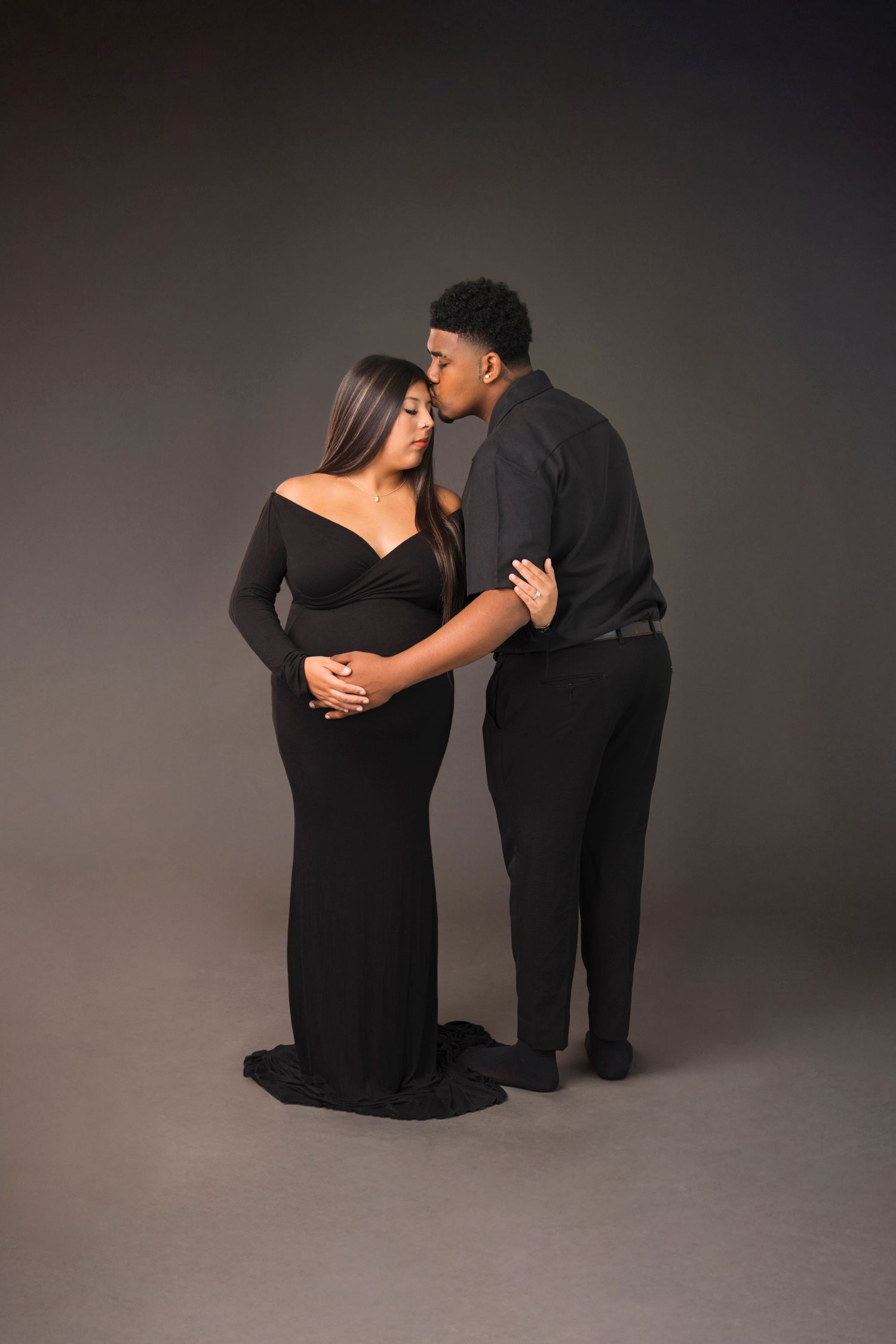 Maternity couple studio portrait black gowns Waco TX Sudden Joy Visuals