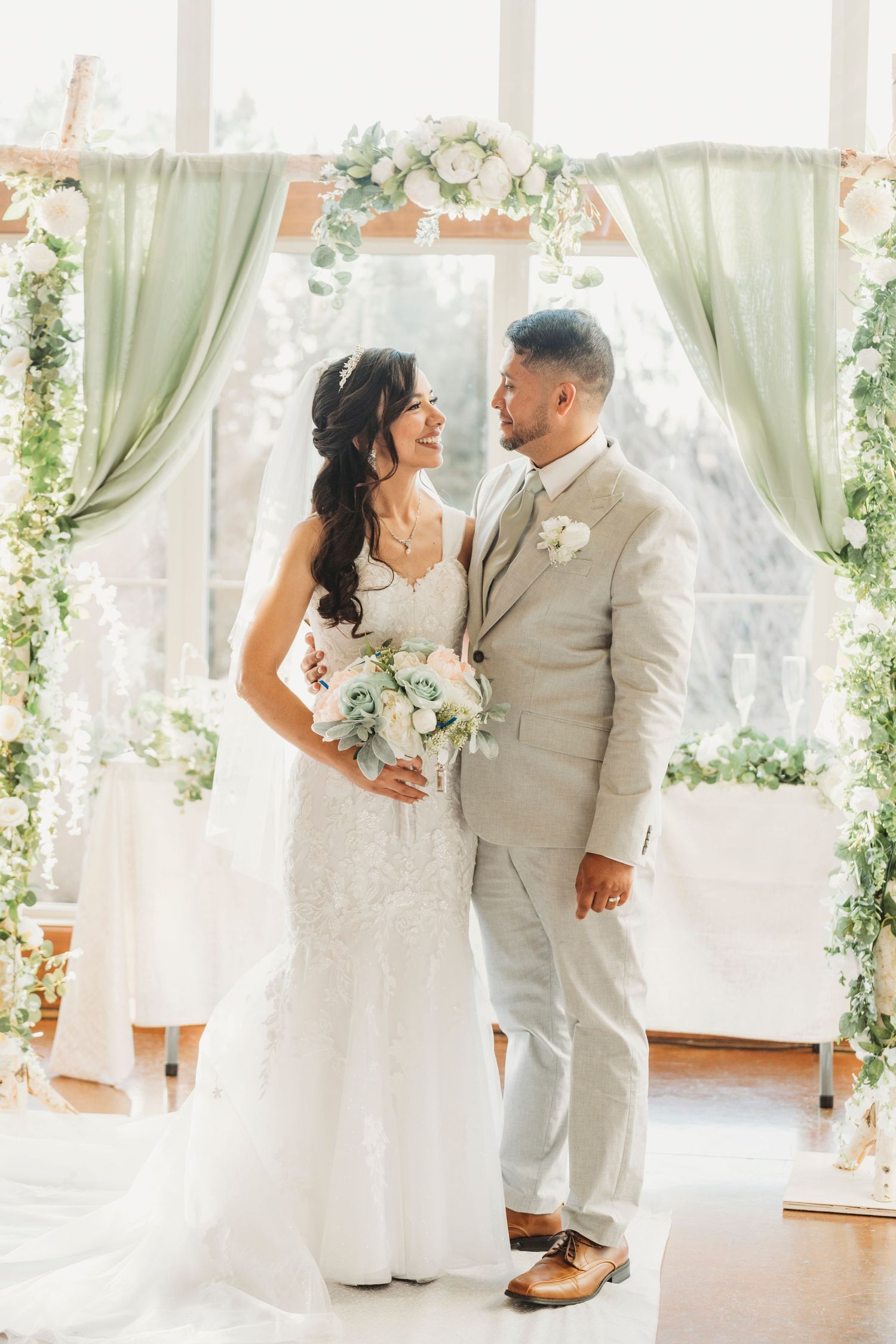 Bride and groom at altar ceremony floral arch wedding photography Waco TX Sudden Joy Visuals