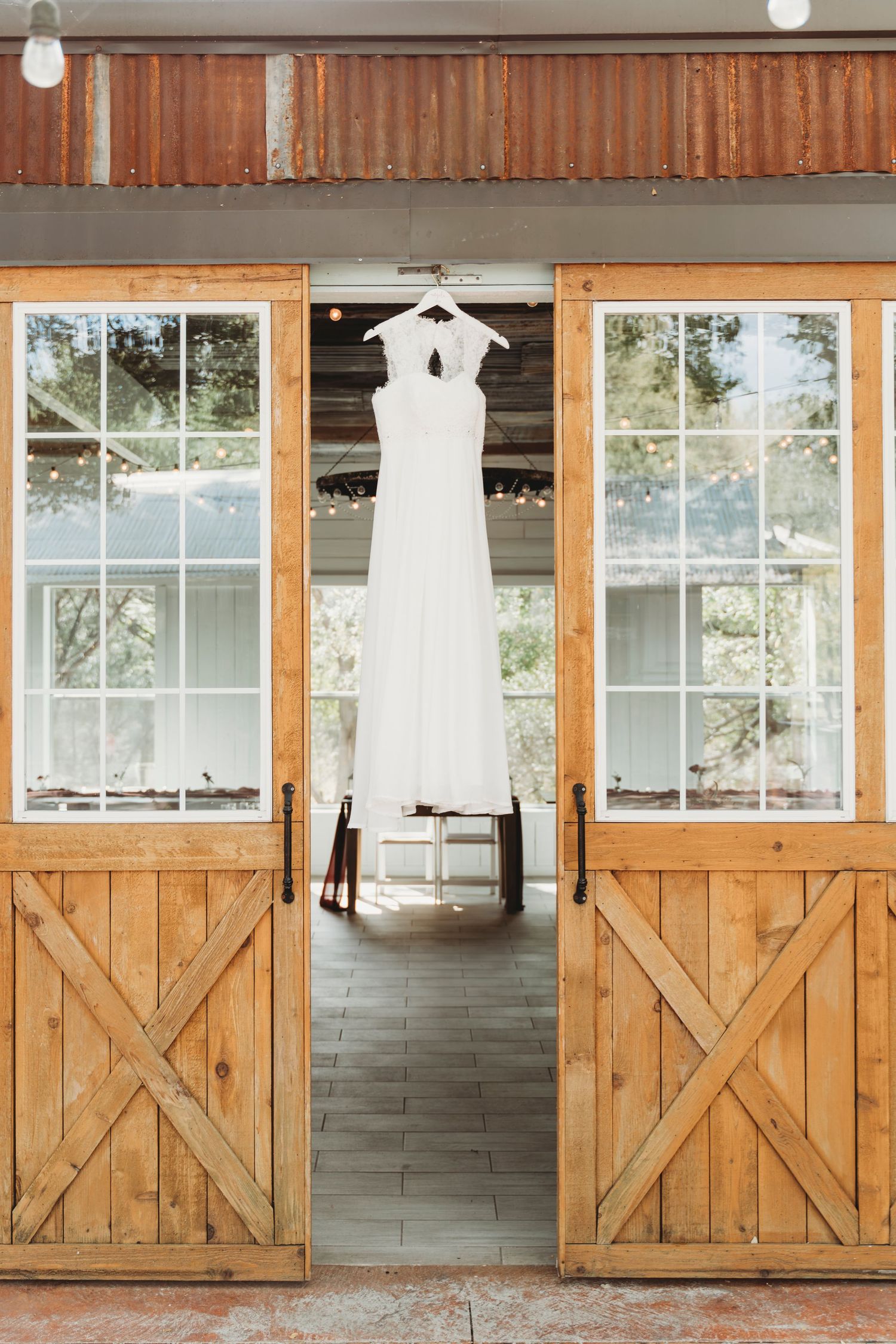 Wedding dress hanging barn doors bridal detail photo Waco TX Sudden Joy Visuals