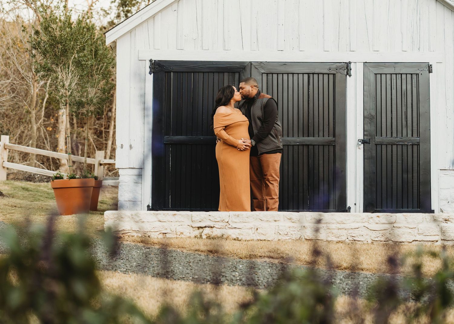 Maternity couple portrait barn door outdoor session Waco TX Sudden Joy Visuals