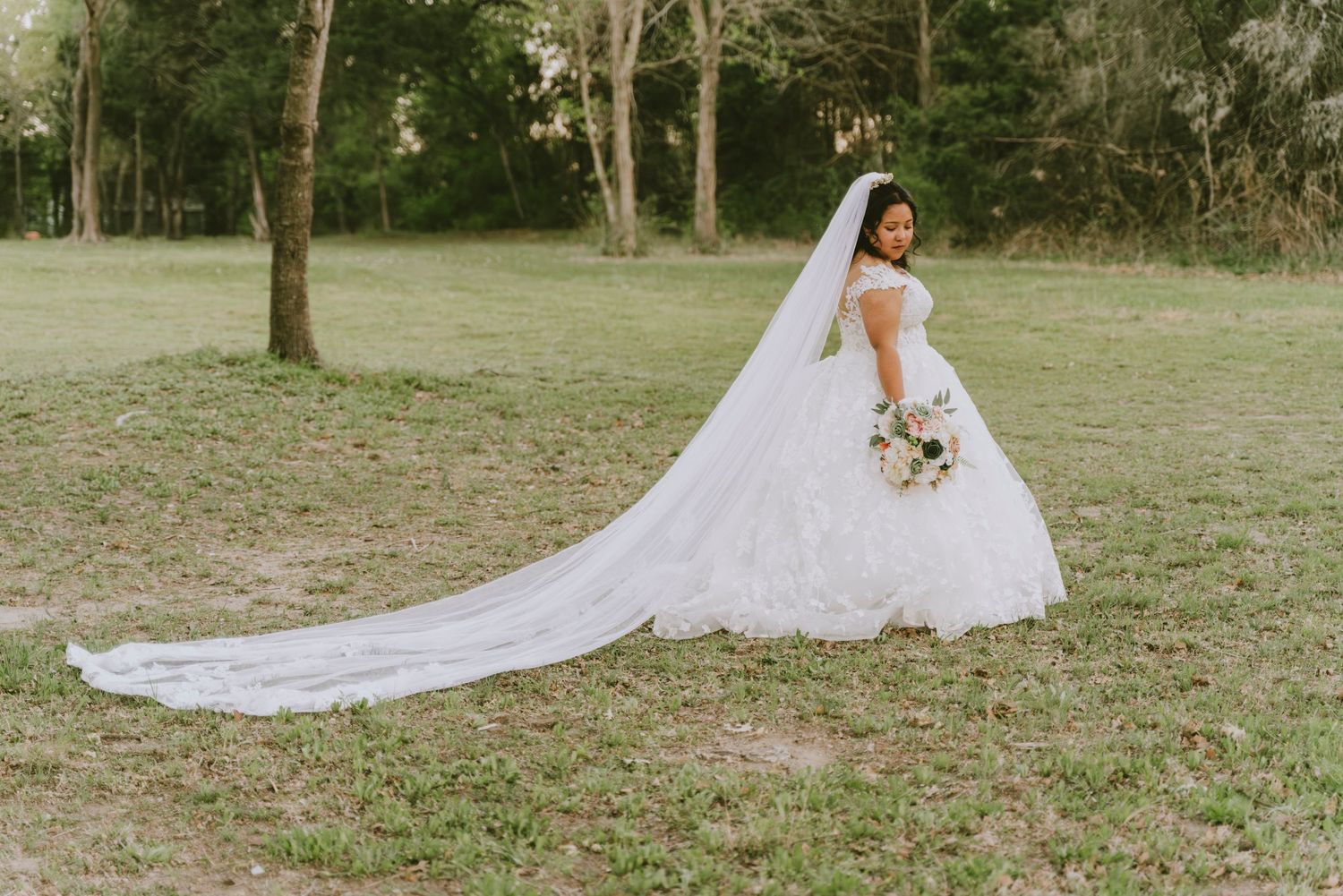 Bride in long cathedral veil walking outdoor bridal portrait Waco TX Sudden Joy Visuals