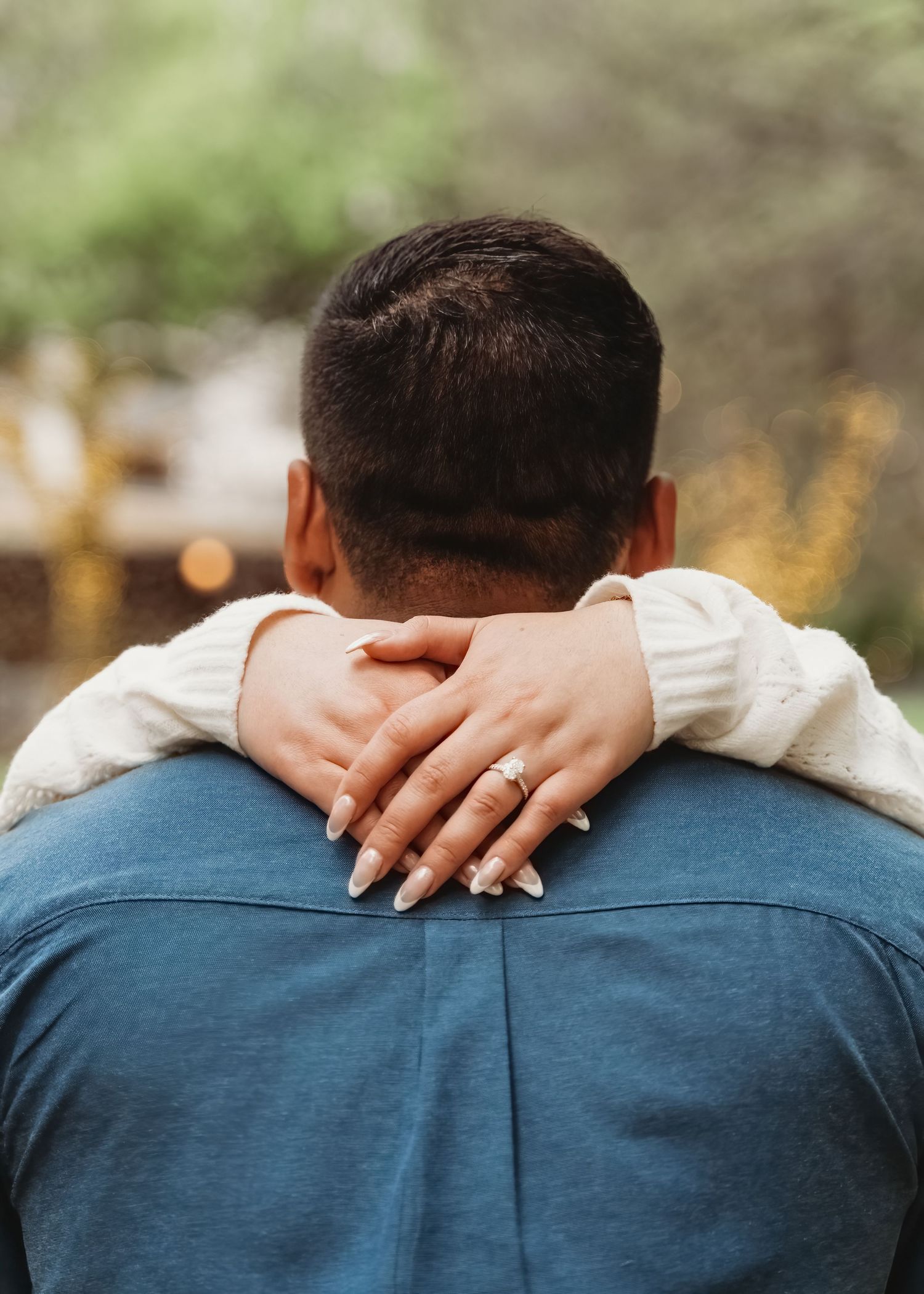 Couple embrace detail hand on back engagement portrait Waco TX Sudden Joy Visuals