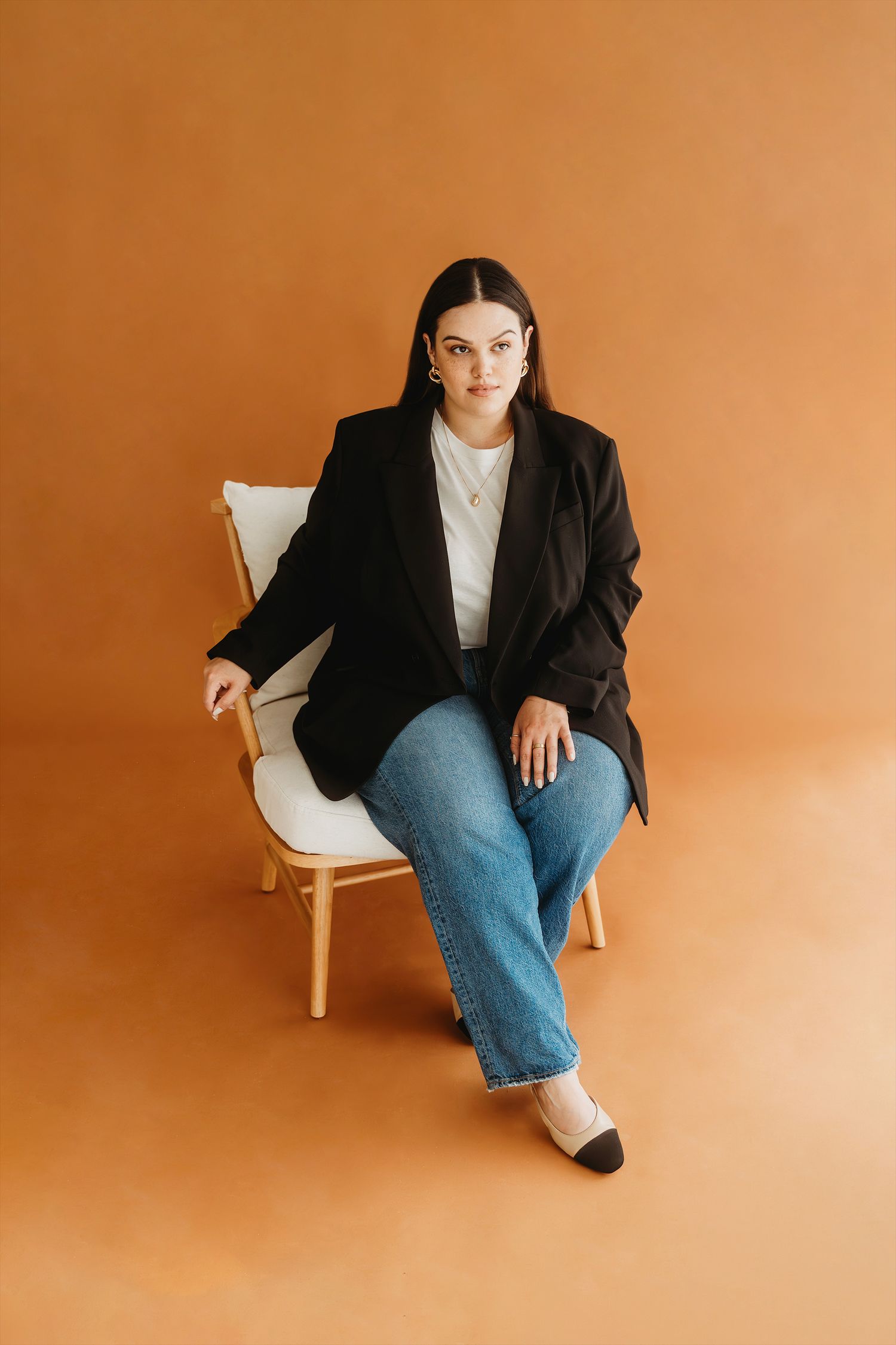 Woman seated personal branding portrait terracotta studio Waco TX Sudden Joy Visuals