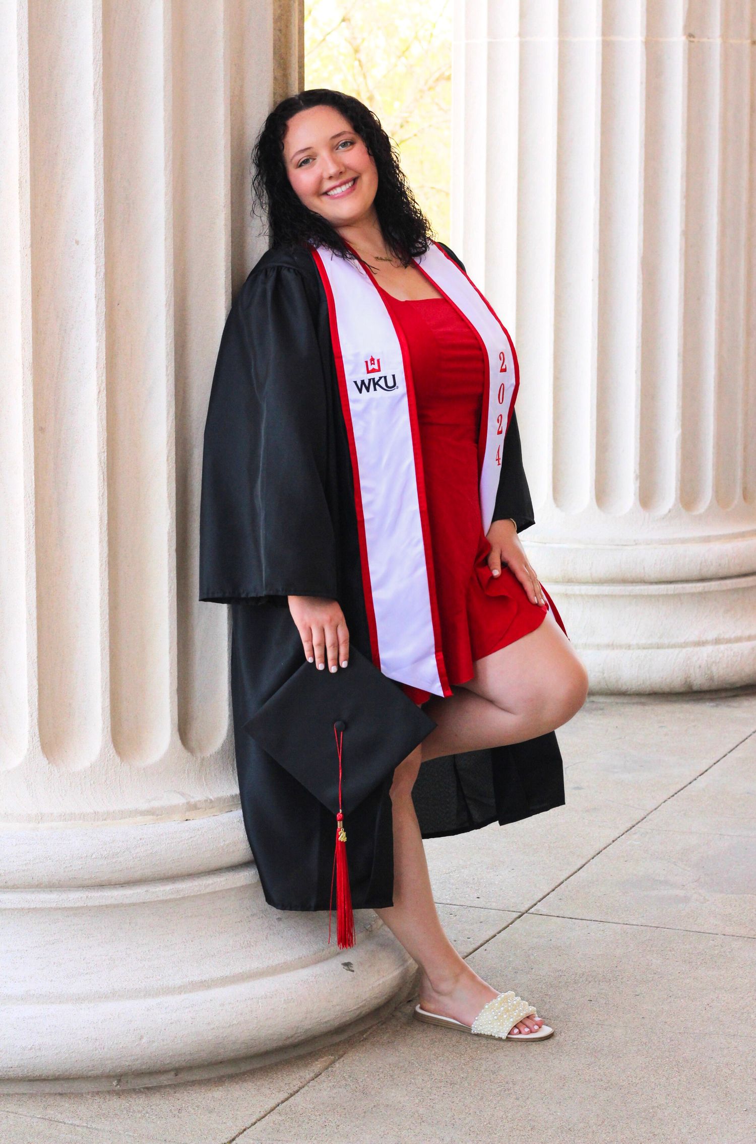 Graduation photos showing poses with cap and gown against white pillars outdoors.