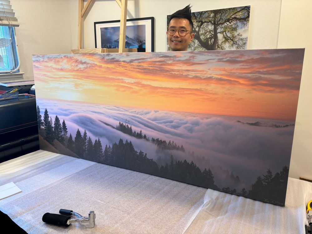 Wide format scenic photograph of fog-covered hills of Mt Tam against vibrant sunset sky. Printed in Escaype Print Lab in Marin County, CA.