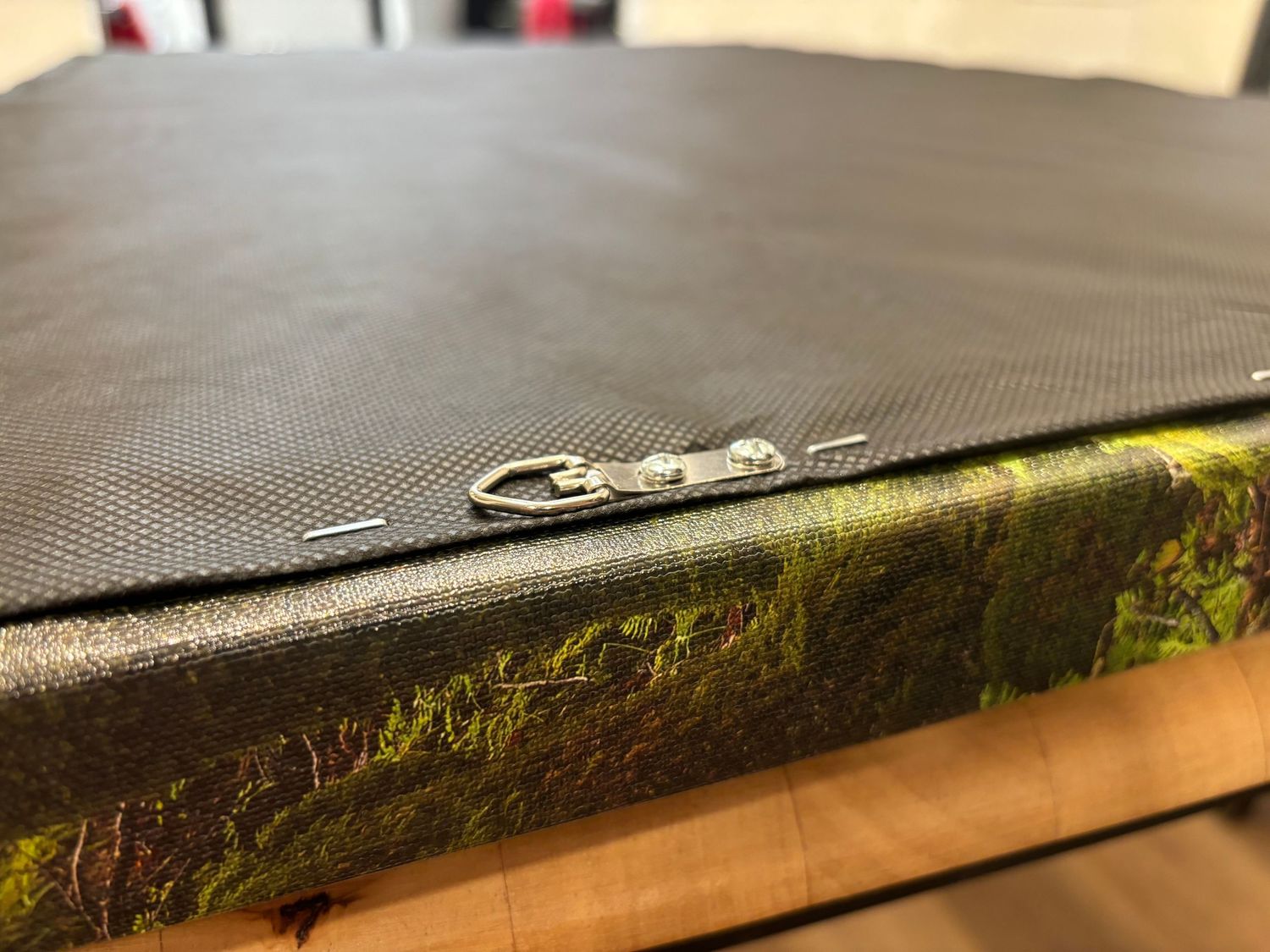 Close-up view of a canvas print edge showing texture and mounting detail. Printed in Escaype Print Lab in Marin County.