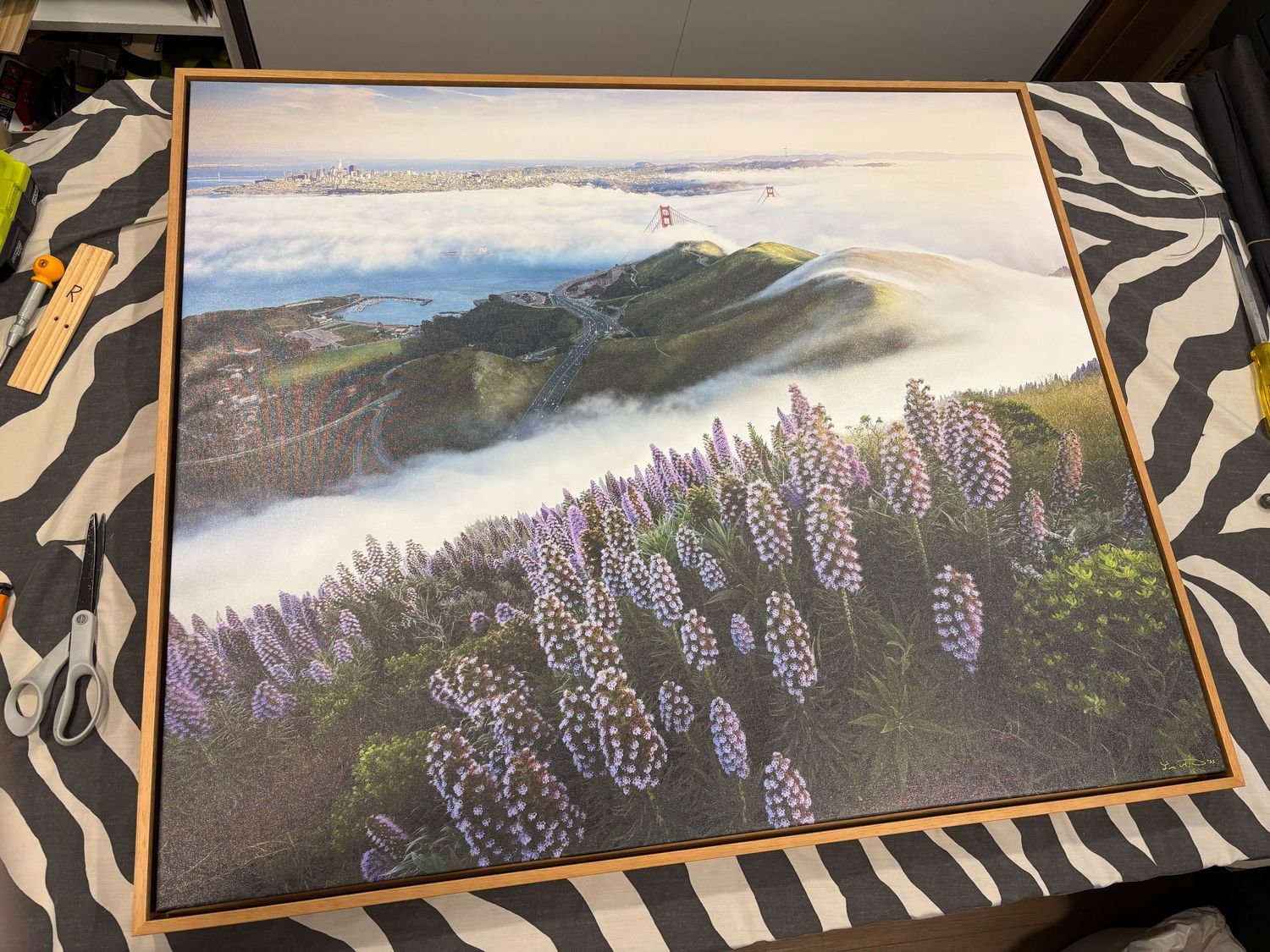 Framed landscape photograph showing purple lupine flowers on a misty mountainside at sunrise. Canvas gallery wrap made in Escaype Print Lab.