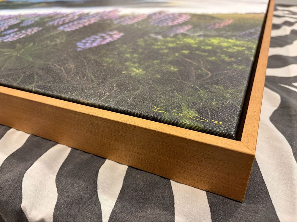 Large panoramic photograph displayed on wooden table showing scenic mountain vista. Printed in Escaype Print Lab in Marin County, CA.