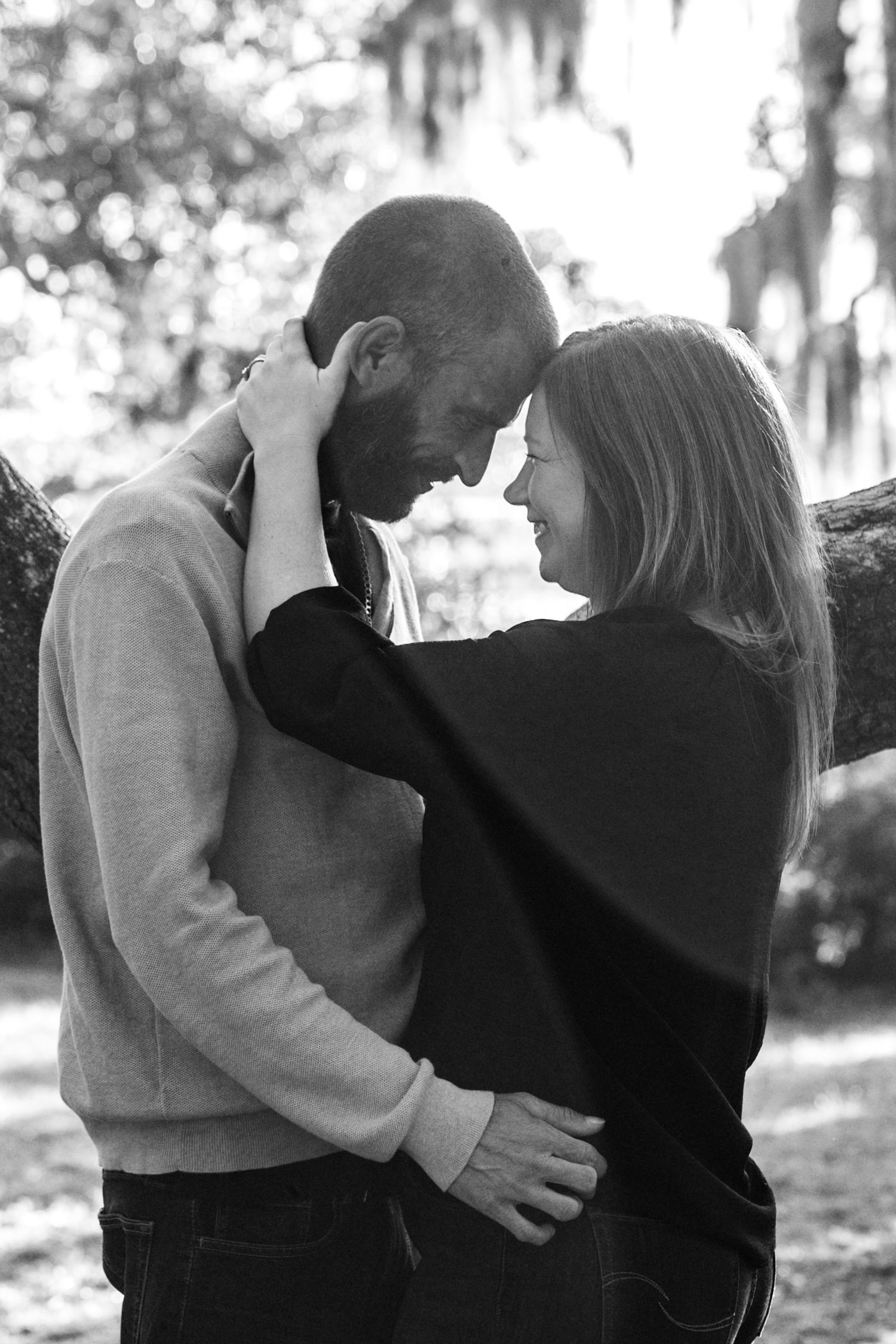 Black and white sequence capturing loving embraces between family members.