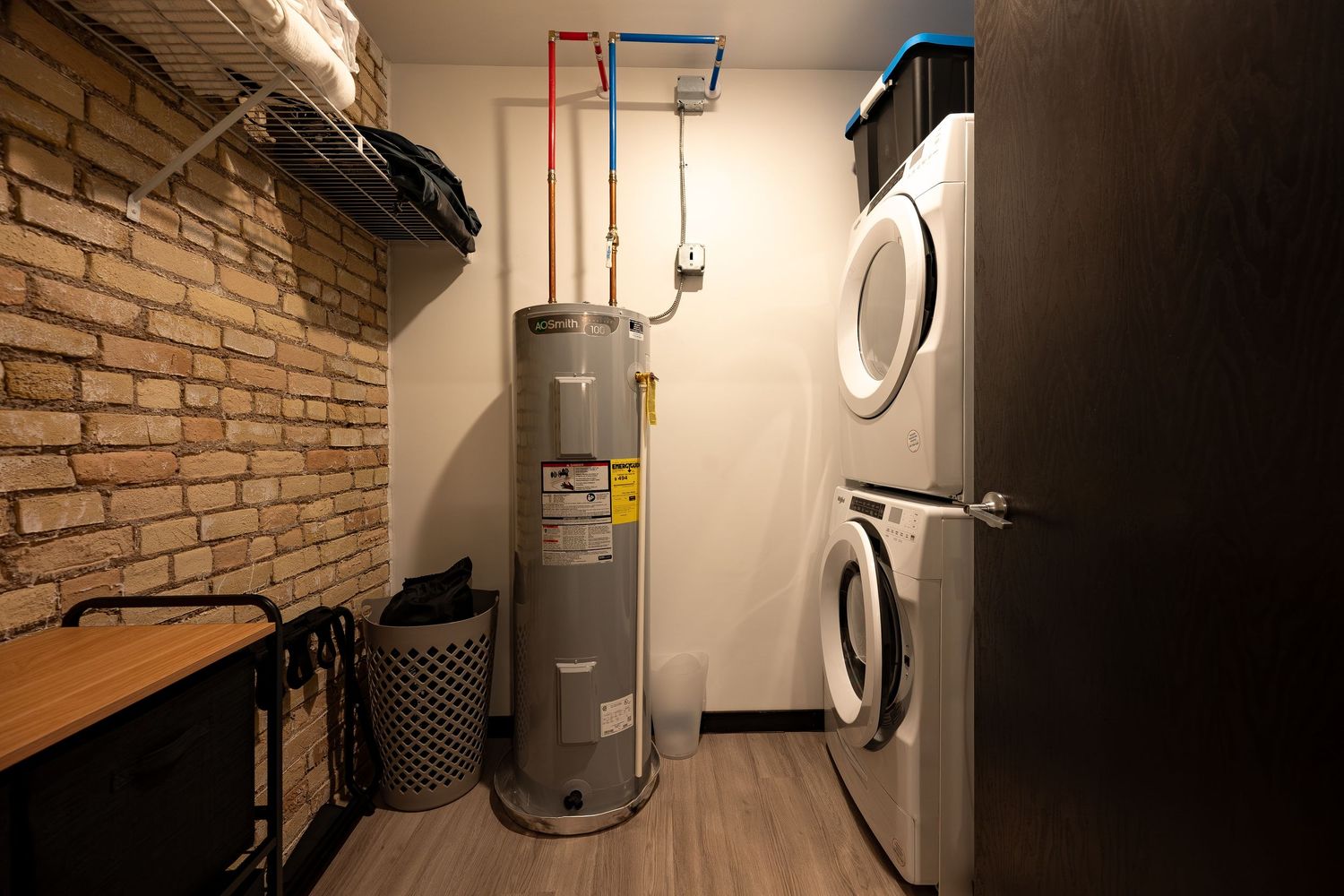 Interior view of a residential HVAC system installation showing furnace and ductwork mounted in a utility room.