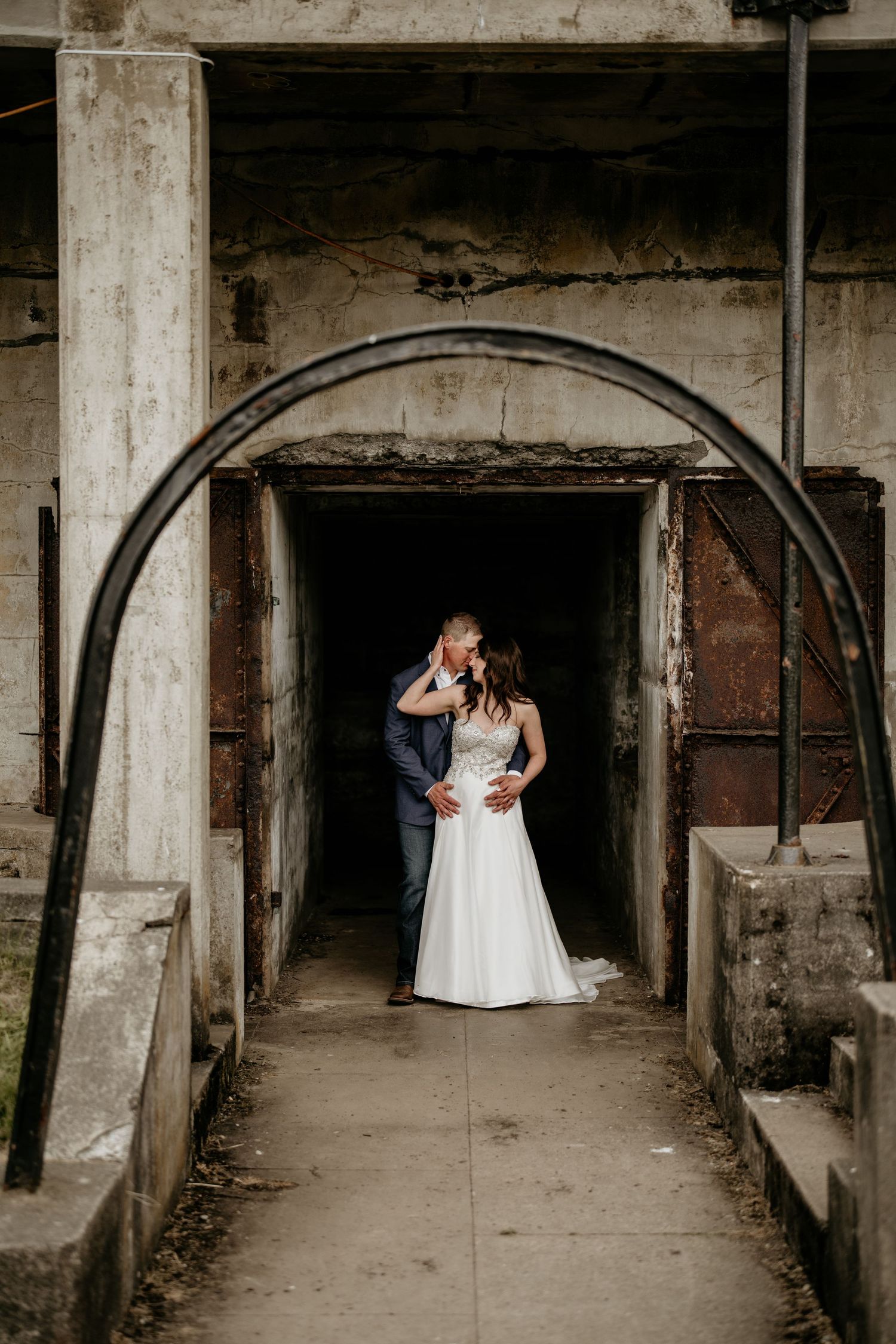 Husband and wife sharing a kiss at a military fort in Washington state.
