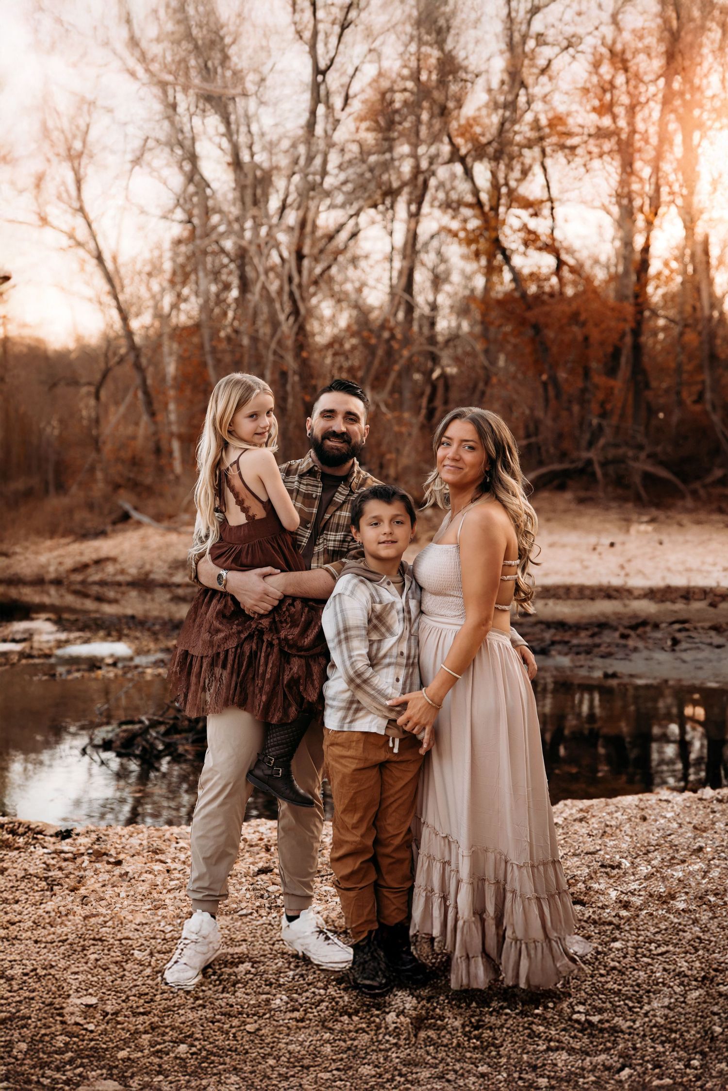 Branson family photographer L. Ballenger with her own family during a fall photo session in the Ozark Mountains by L. Ballenger Photography.