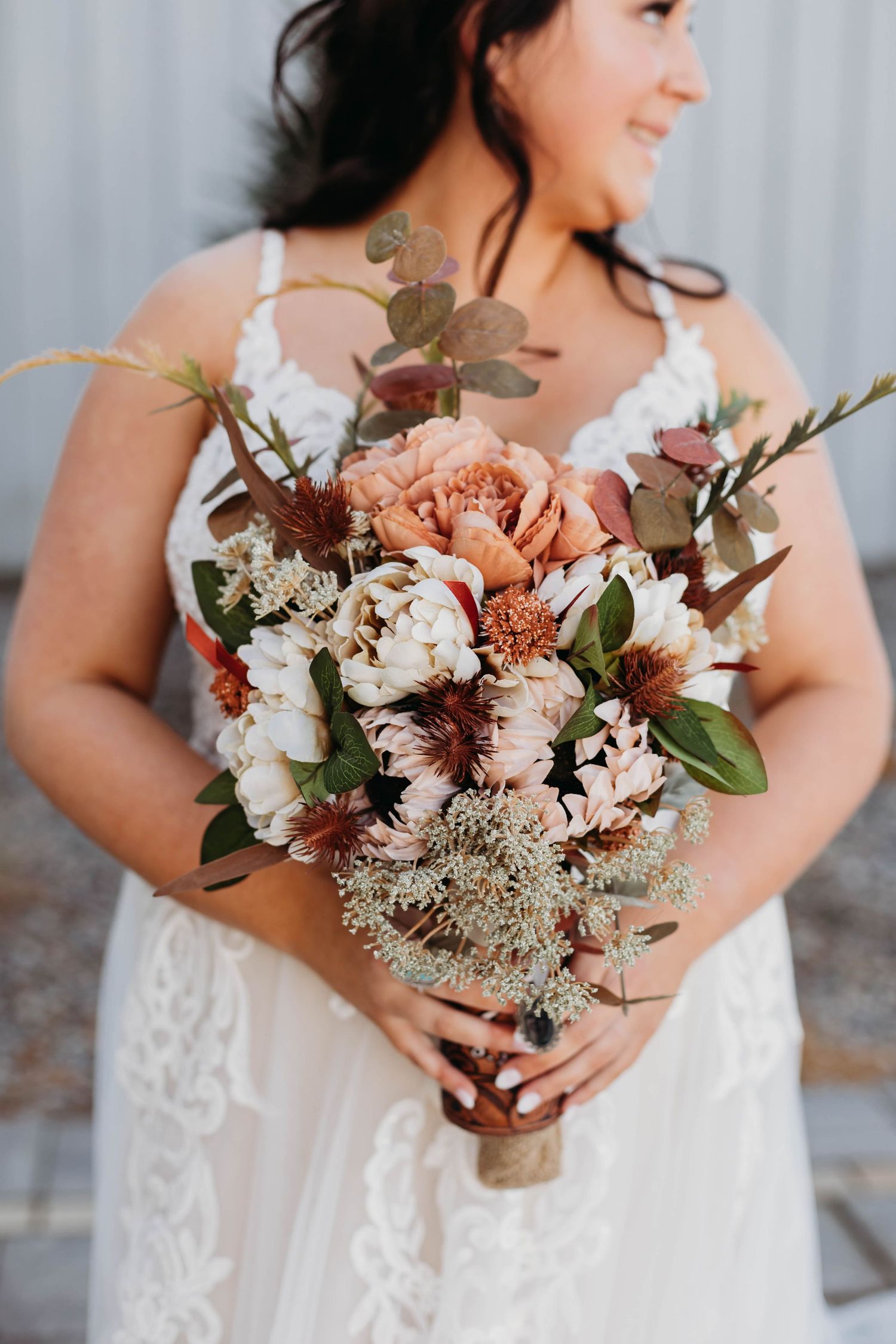 Beautiful bridal portrait and bouquet detail by Branson Missouri wedding photographer L. Ballenger Photography.
